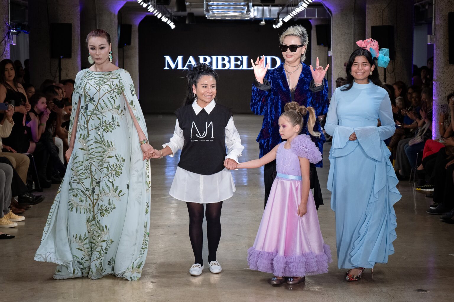 LOS ANGELES, CALIFORNIA - OCTOBER 18: Designer Maribel Julcahuanca and models walk the runway at the Maribel JD show during Los Angeles Fashion Week Powered By Art Hearts Fashion at The New Mart on October 18, 2025 in Los Angeles, California. (Photo by Mark Gunter/Getty Images for Art Hearts Fashion)
