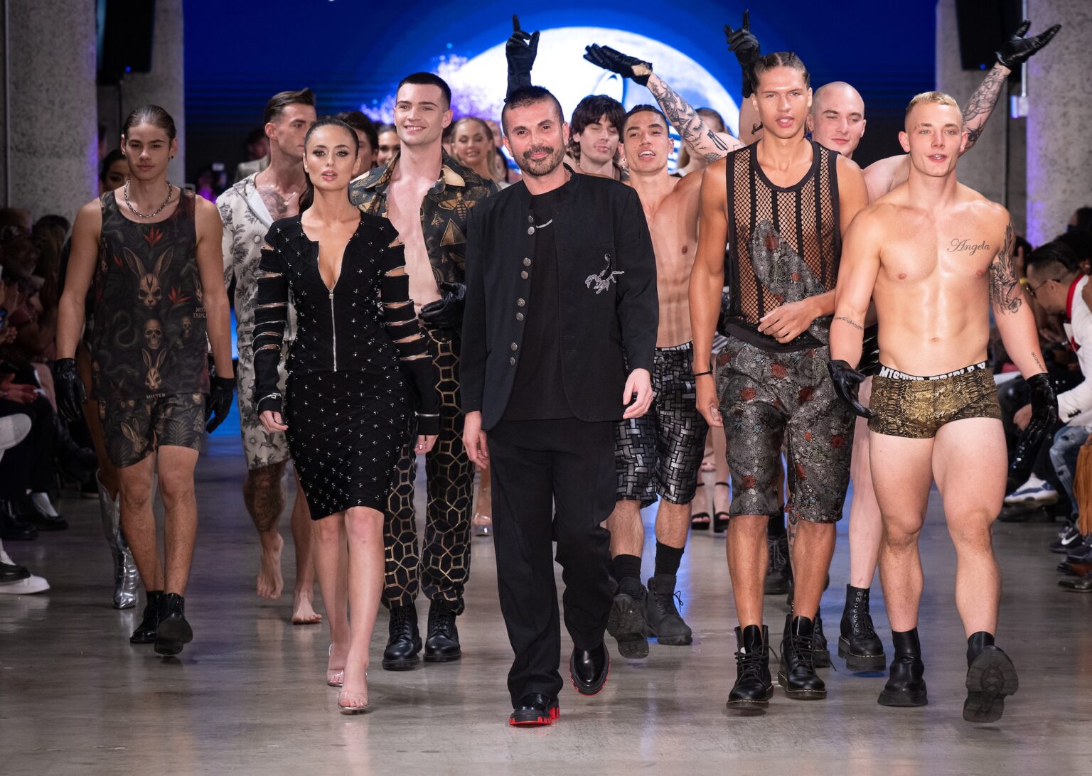 LOS ANGELES, CALIFORNIA - OCTOBER 18: Designer Erik Rosete and models walk the runway at the Mister Triple X show during Los Angeles Fashion Week Powered By Art Hearts Fashion at The New Mart on October 18, 2025 in Los Angeles, California. (Photo by Mark Gunter/Getty Images for Art Hearts Fashion)