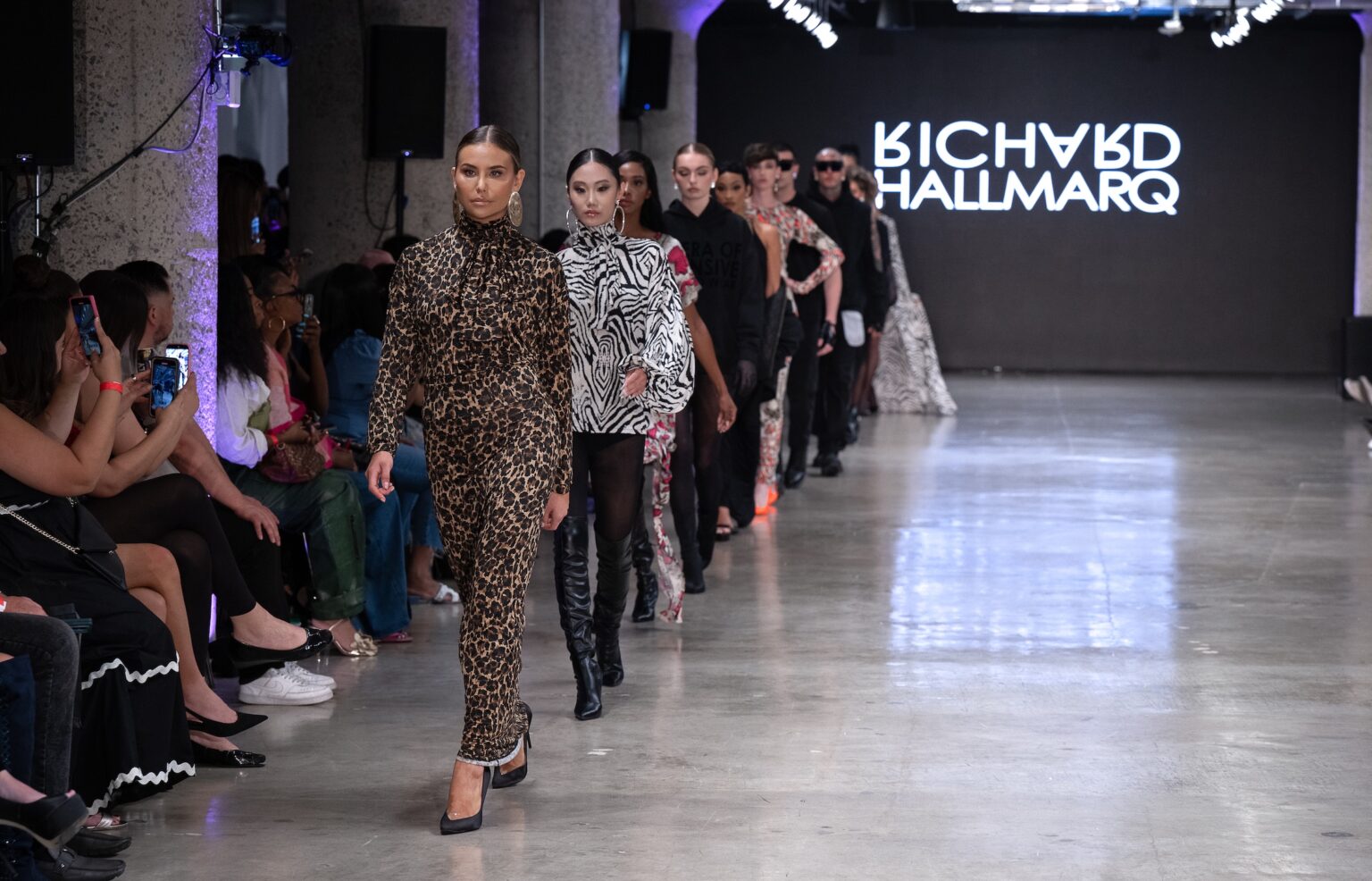 LOS ANGELES, CALIFORNIA - OCTOBER 18: Models walk the runway at the Richard Hallmarq show during Los Angeles Fashion Week Powered By Art Hearts Fashion at The New Mart on October 18, 2025 in Los Angeles, California. (Photo by Mark Gunter/Getty Images for Art Hearts Fashion)