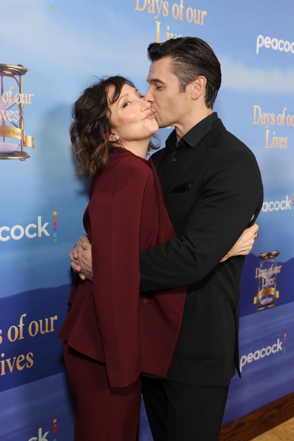 DAYS OF OUR LIVES -- "60th Anniversary Red Carpet" Episode -- Pictured: (l-r) Carmen Cusack, Paul Telfer -- (Photo by: Todd Williamson/Peacock)