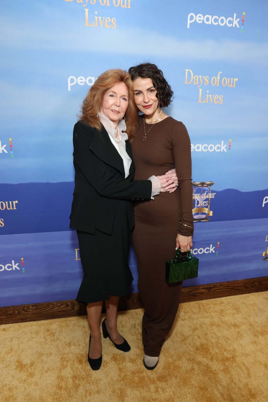 DAYS OF OUR LIVES -- "60th Anniversary Red Carpet" Episode -- Pictured: (l-r) Suzanne Rogers, Linsey Godfrey -- (Photo by: Todd Williamson/Peacock)
