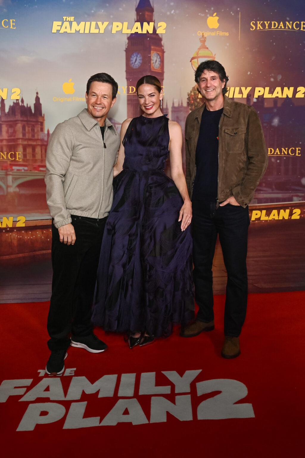LONDON, ENGLAND - NOVEMBER 11: (L to R) Mark Wahlberg, Michelle Monaghan and Apple Head of Worldwide Video Jamie Erlicht attend the World Premiere of Apple Original Films' "The Family Plan 2" at Curzon Mayfair on November 11, 2025 in London, England. "The Family Plan 2" will premiere globally on Apple TV on Friday, November 21, 2025. Photo Credit: Dave Benett