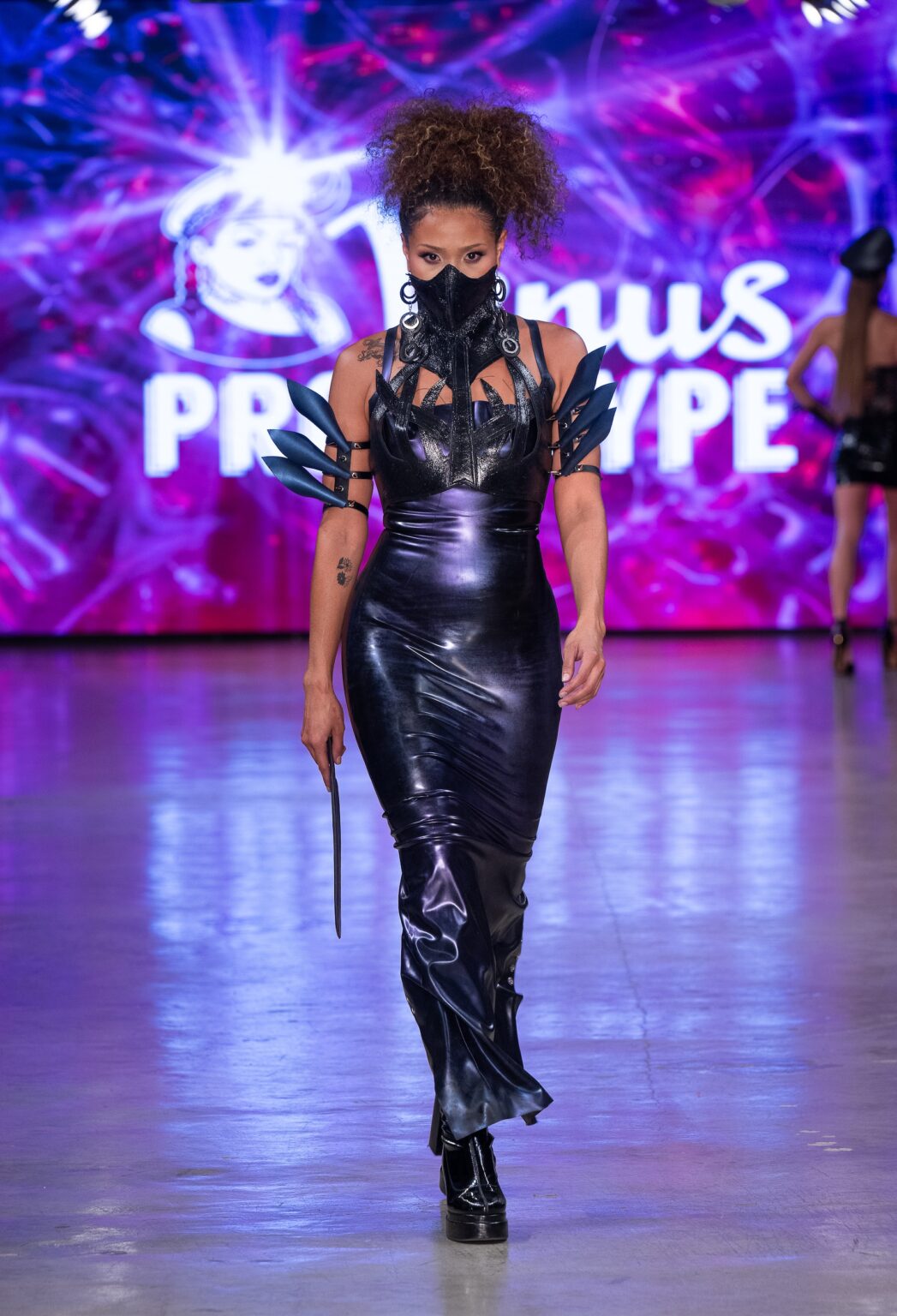 LOS ANGELES, CALIFORNIA - OCTOBER 18: A model walks the runway at the Venus Prototype show during Los Angeles Fashion Week Powered By Art Hearts Fashion at The New Mart on October 18, 2025 in Los Angeles, California. (Photo by Mark Gunter/Getty Images for Art Hearts Fashion)