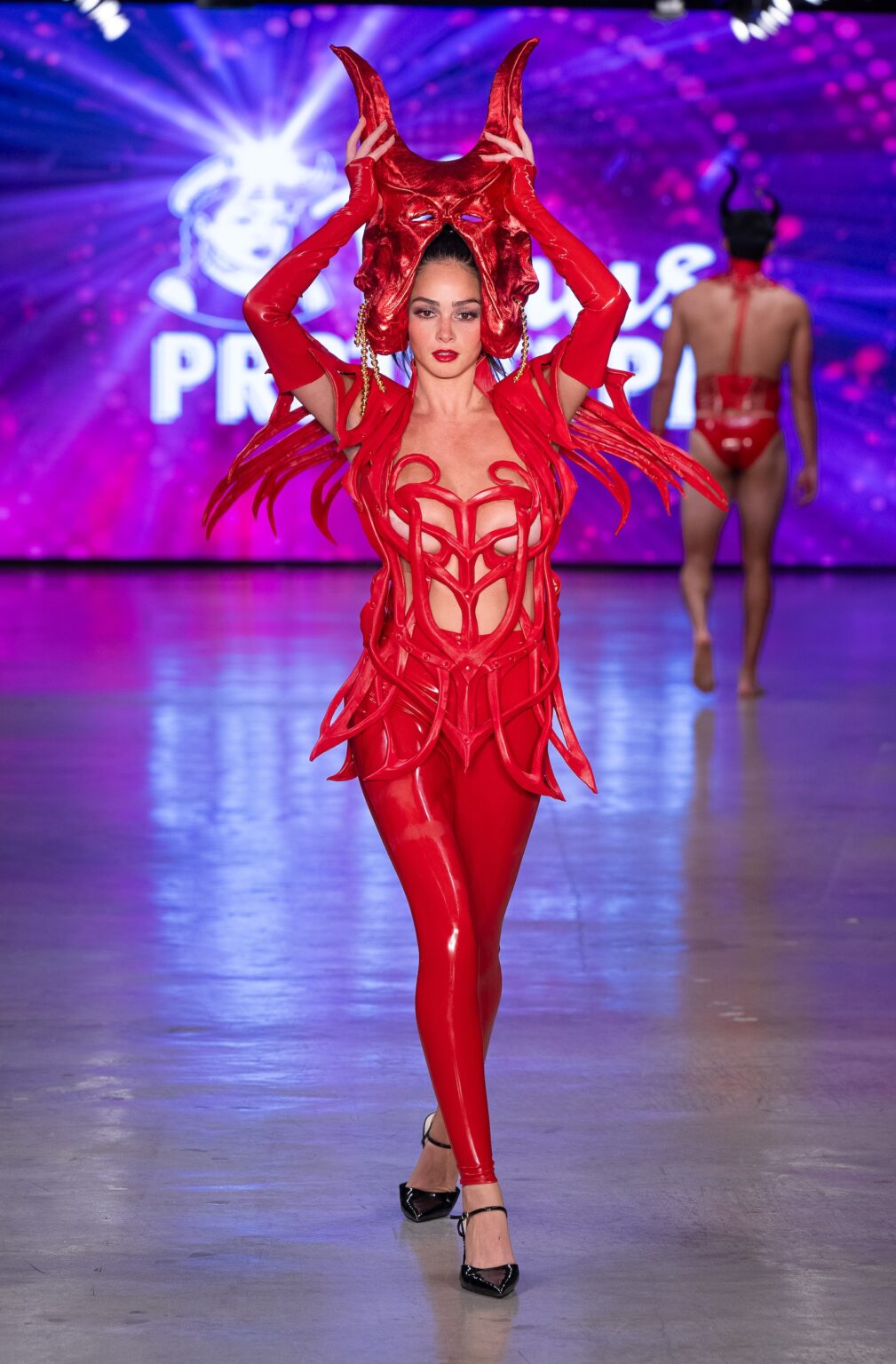 LOS ANGELES, CALIFORNIA - OCTOBER 18: A model walks the runway at the Venus Prototype show during Los Angeles Fashion Week Powered By Art Hearts Fashion at The New Mart on October 18, 2025 in Los Angeles, California. (Photo by Mark Gunter/Getty Images for Art Hearts Fashion)