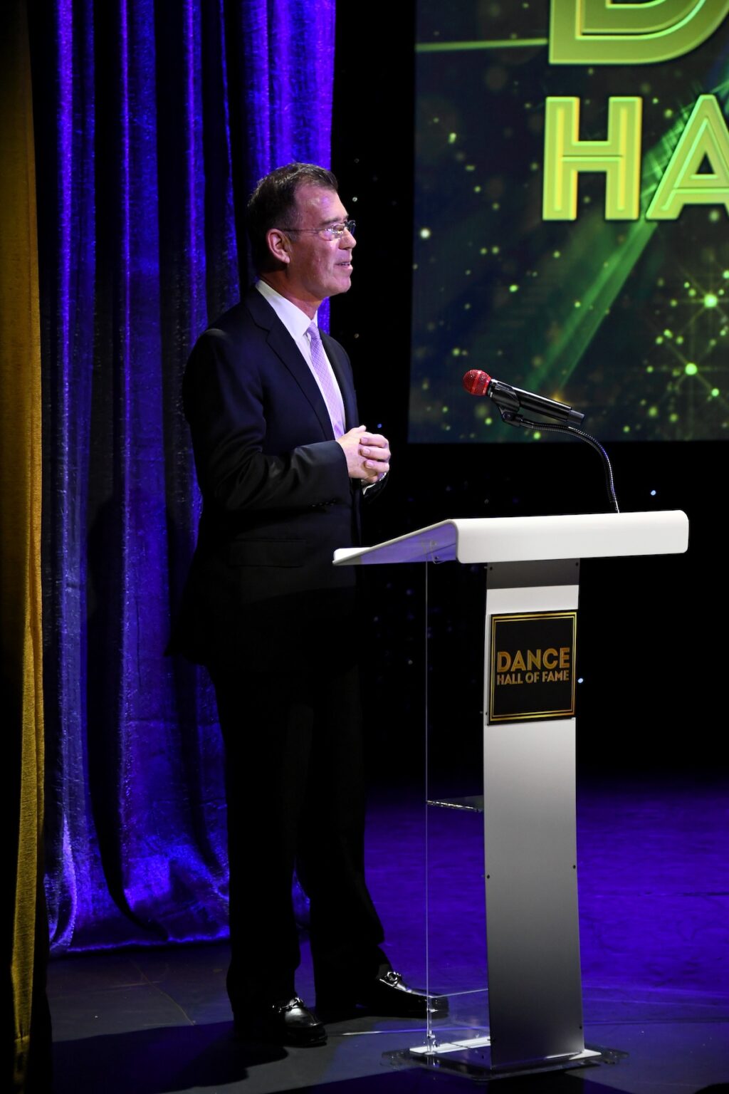 CULVER CITY, CALIFORNIA - DECEMBER 03: Jamie Bishton speaks onstage during the inaugural Dance Hall of Fame ceremony honoring the most influential artists in dance history at Glorya Kaufman Community Center on December 03, 2025 in Culver City, California. (Photo by Alberto E. Rodriguez/Getty Images for Dance Hall of Fame)
