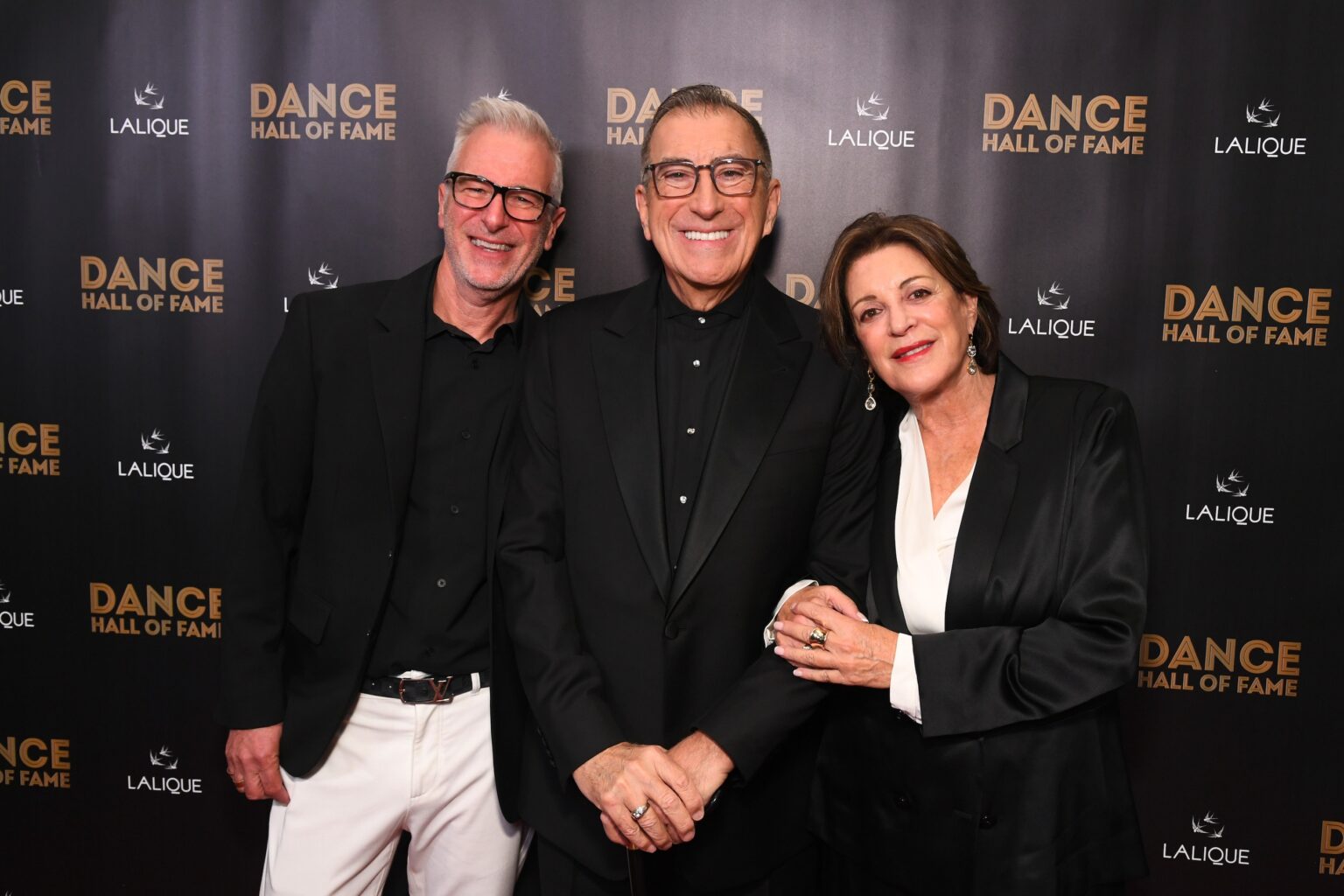 CULVER CITY, CALIFORNIA - DECEMBER 03: (L-R) Tony Selznick, Kenny Ortega, and Julie McDonald attend the inaugural Dance Hall of Fame ceremony honoring the most influential artists in dance history at Glorya Kaufman Community Center on December 03, 2025 in Culver City, California. (Photo by Alberto E. Rodriguez/Getty Images for Dance Hall of Fame)