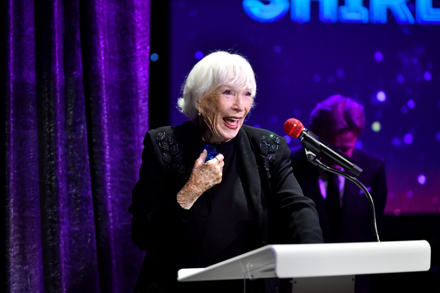CULVER CITY, CALIFORNIA - DECEMBER 03: Shirley MacLaine accepts the Lifetime Achievement Award onstage during the inaugural Dance Hall of Fame ceremony honoring the most influential artists in dance history at Glorya Kaufman Community Center on December 03, 2025 in Culver City, California. (Photo by Alberto E. Rodriguez/Getty Images for Dance Hall of Fame)