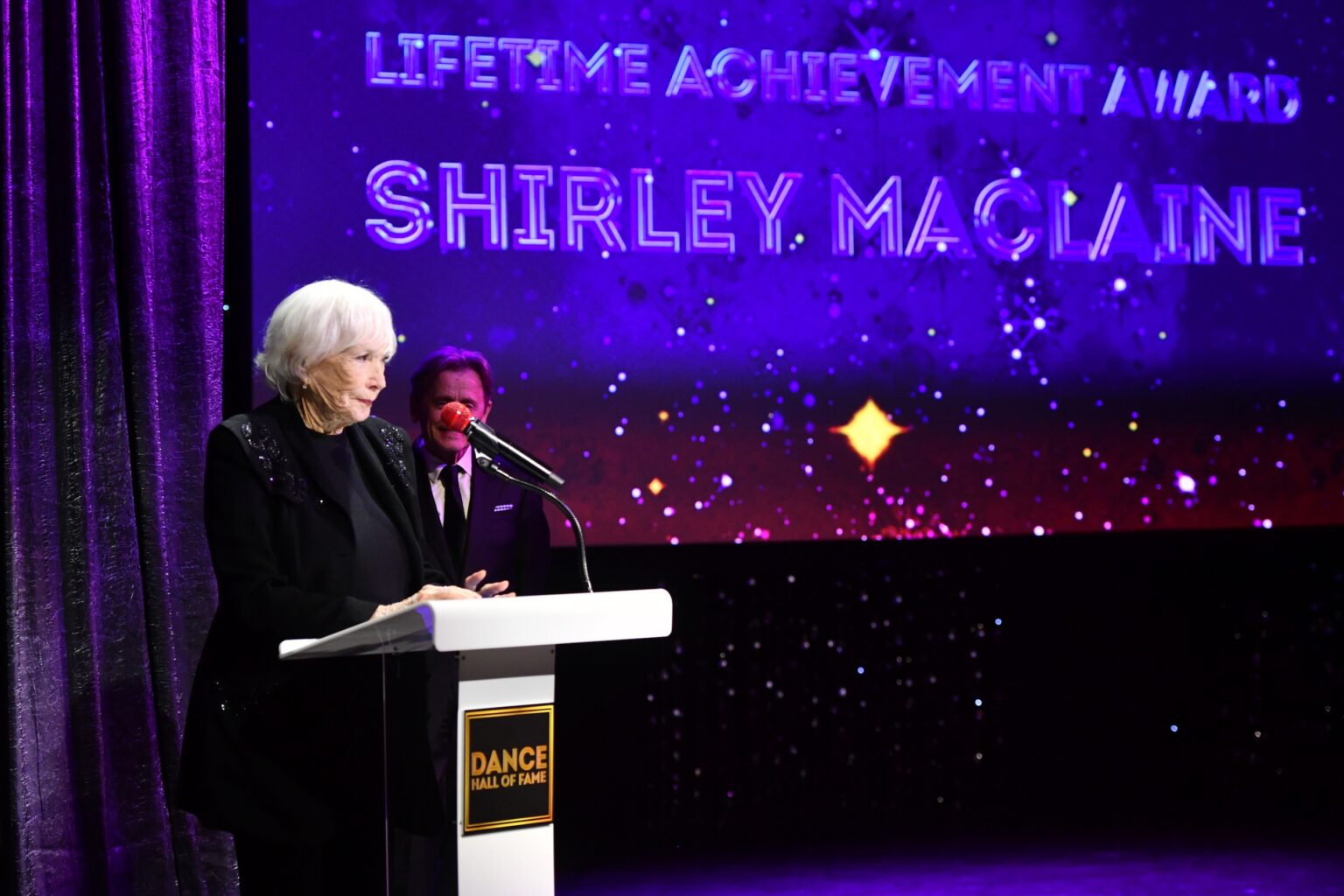 CULVER CITY, CALIFORNIA - DECEMBER 03: Shirley MacLaine accepts the Lifetime Achievement Award onstage during the inaugural Dance Hall of Fame ceremony honoring the most influential artists in dance history at Glorya Kaufman Community Center on December 03, 2025 in Culver City, California. (Photo by Alberto E. Rodriguez/Getty Images for Dance Hall of Fame)