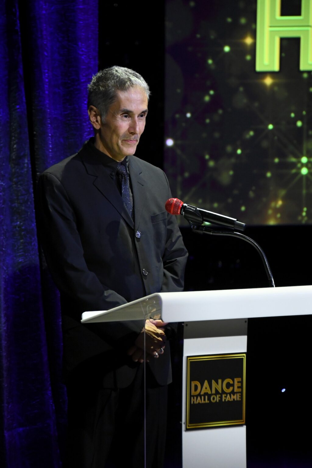 CULVER CITY, CALIFORNIA - DECEMBER 03: Hector Guerrero speaks onstage during the inaugural Dance Hall of Fame ceremony honoring the most influential artists in dance history at Glorya Kaufman Community Center on December 03, 2025 in Culver City, California. (Photo by Alberto E. Rodriguez/Getty Images for Dance Hall of Fame)