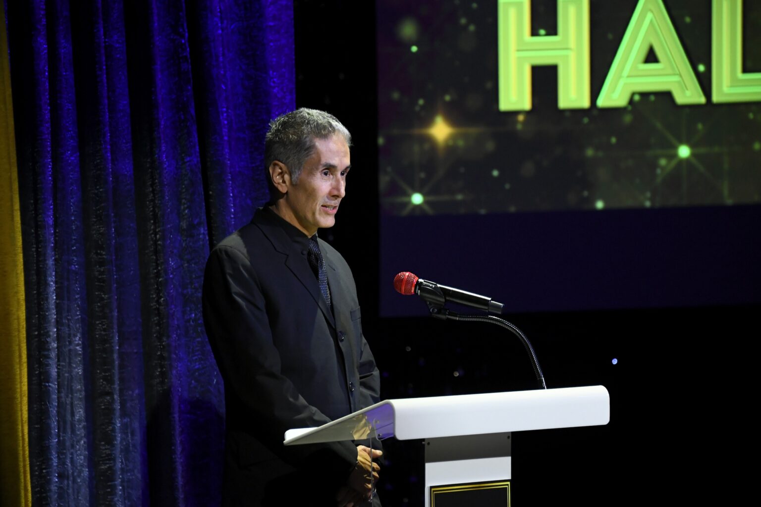 CULVER CITY, CALIFORNIA - DECEMBER 03: Hector Guerrero speaks onstage during the inaugural Dance Hall of Fame ceremony honoring the most influential artists in dance history at Glorya Kaufman Community Center on December 03, 2025 in Culver City, California. (Photo by Alberto E. Rodriguez/Getty Images for Dance Hall of Fame)