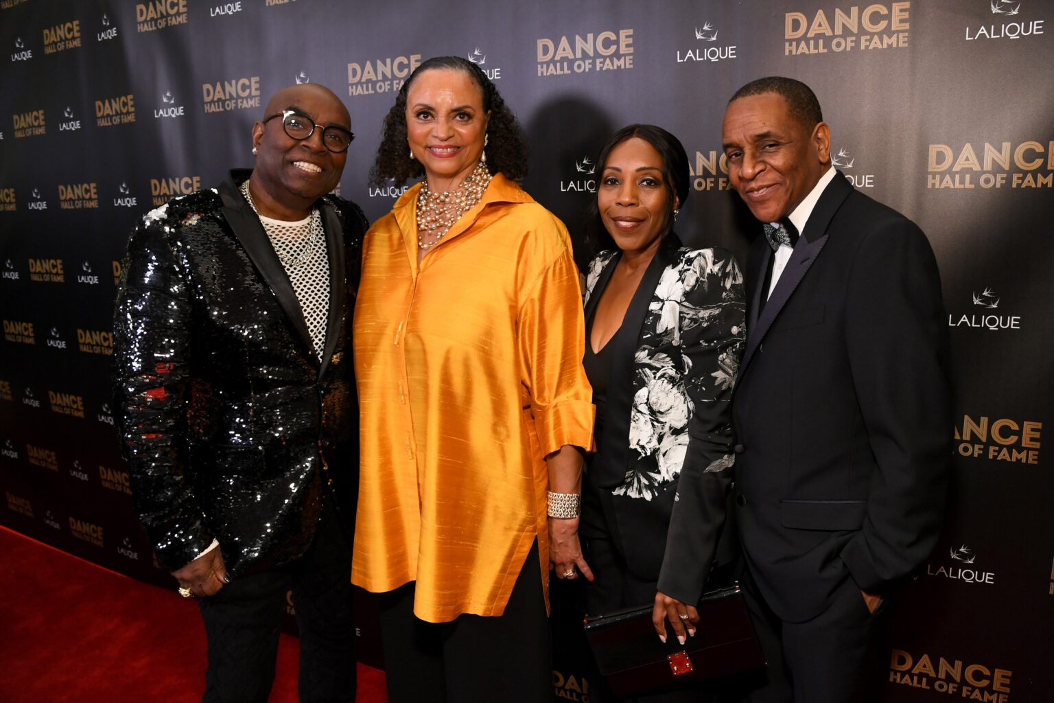 CULVER CITY, CALIFORNIA - DECEMBER 03: (L-R) Stuart K. Robinson, Donna Wood, Renae Williams Niles, and a guest attend the inaugural Dance Hall of Fame ceremony honoring the most influential artists in dance history at Glorya Kaufman Community Center on December 03, 2025 in Culver City, California. (Photo by Alberto E. Rodriguez/Getty Images for Dance Hall of Fame)