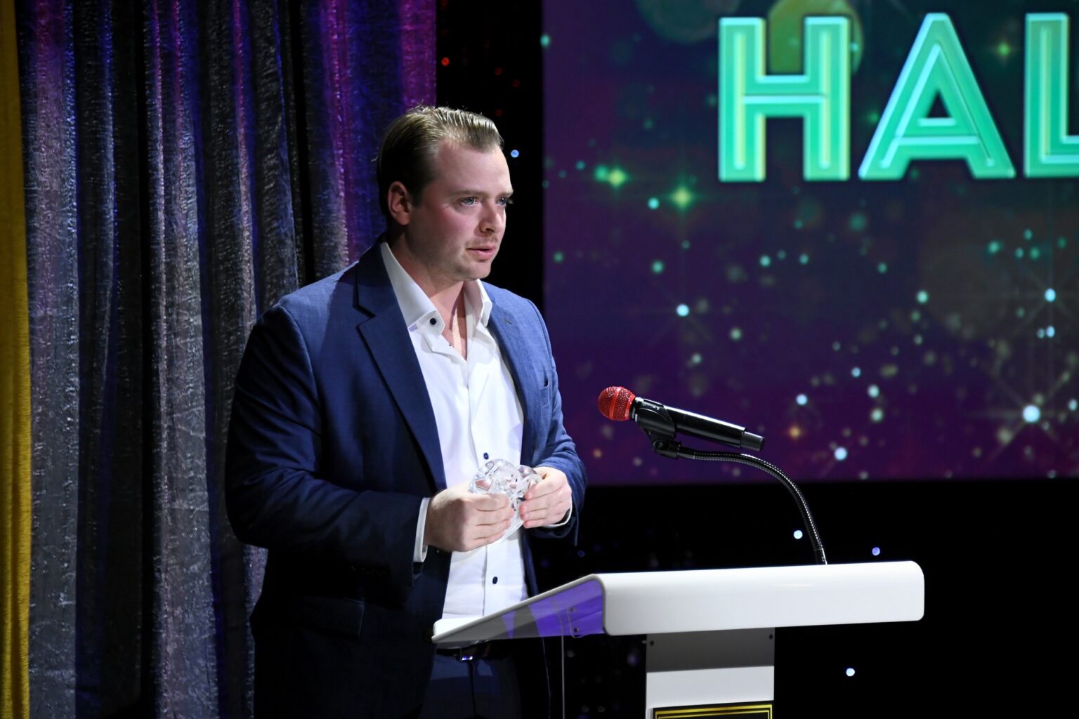 CULVER CITY, CALIFORNIA - DECEMBER 03: Noah Fosse accepts honor on behalf of Bob Fosse onstage during the inaugural Dance Hall of Fame ceremony honoring the most influential artists in dance history at Glorya Kaufman Community Center on December 03, 2025 in Culver City, California. (Photo by Alberto E. Rodriguez/Getty Images for Dance Hall of Fame)