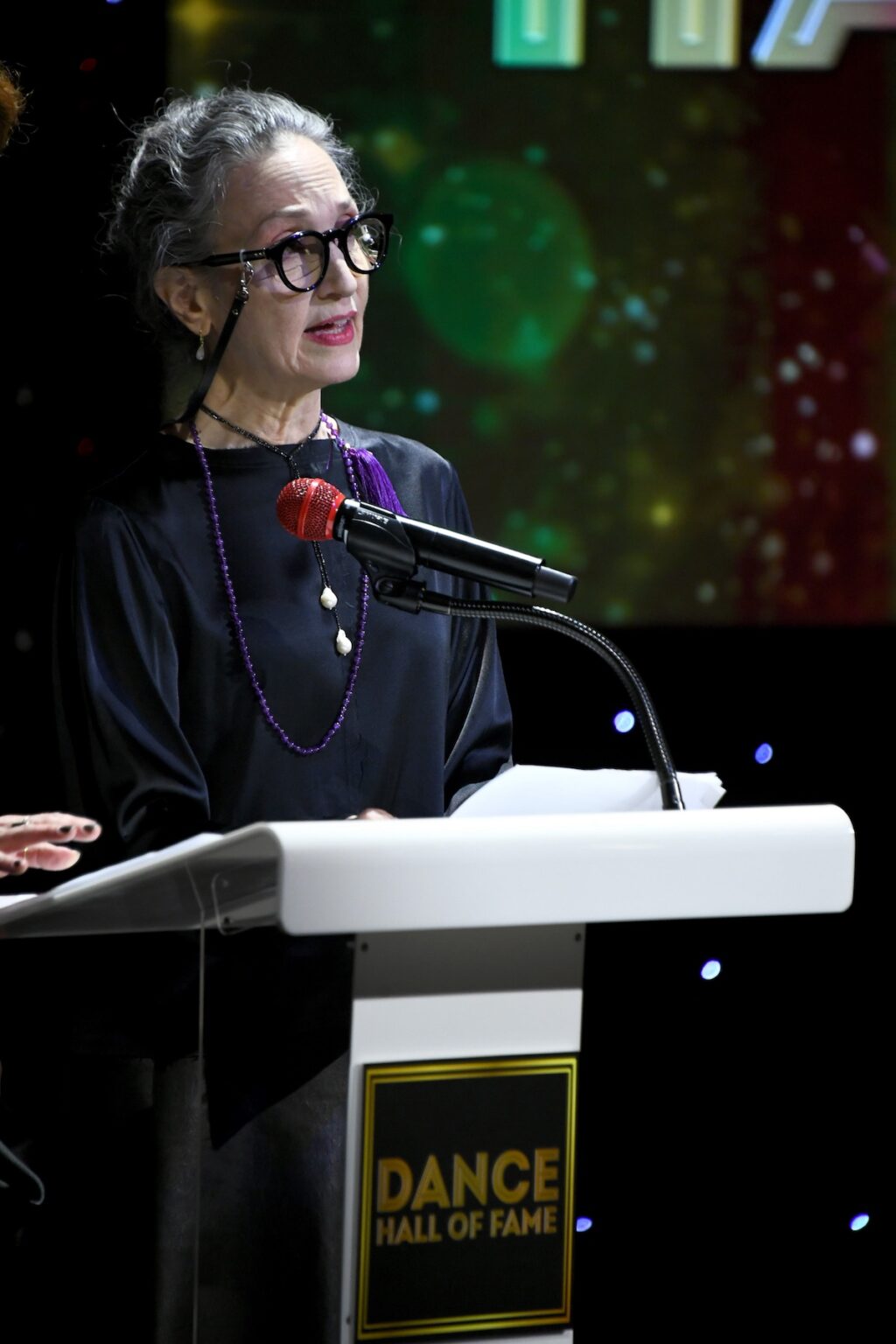 CULVER CITY, CALIFORNIA - DECEMBER 03: Bebe Neuwirth speaks onstage during the inaugural Dance Hall of Fame ceremony honoring the most influential artists in dance history at Glorya Kaufman Community Center on December 03, 2025 in Culver City, California. (Photo by Alberto E. Rodriguez/Getty Images for Dance Hall of Fame)