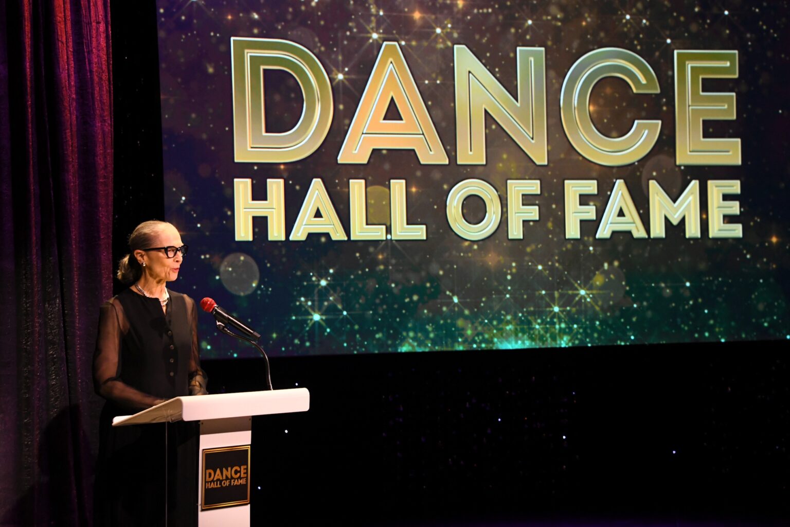 CULVER CITY, CALIFORNIA - DECEMBER 03: Janet Eilber speaks onstage during the inaugural Dance Hall of Fame ceremony honoring the most influential artists in dance history at Glorya Kaufman Community Center on December 03, 2025 in Culver City, California. (Photo by Alberto E. Rodriguez/Getty Images for Dance Hall of Fame)