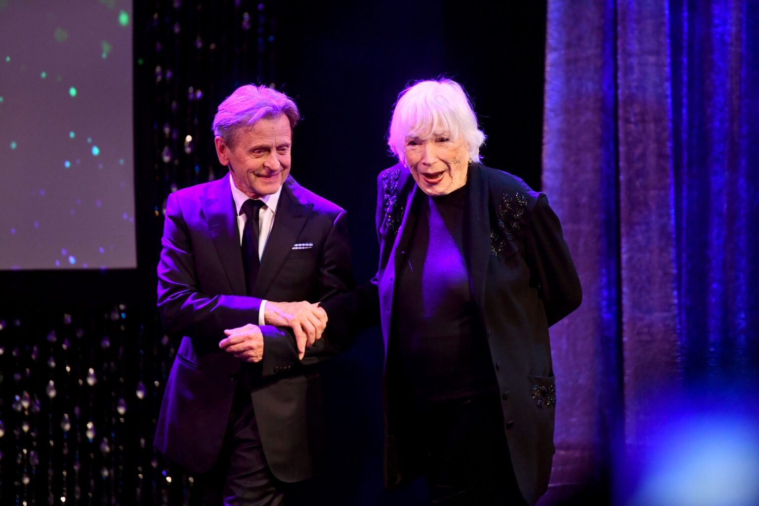 CULVER CITY, CALIFORNIA - DECEMBER 03: (L-R) Mikhail Baryshnikov and Shirley MacLaine are seen onstage during the inaugural Dance Hall of Fame ceremony honoring the most influential artists in dance history at Glorya Kaufman Community Center on December 03, 2025 in Culver City, California. (Photo by Alberto E. Rodriguez/Getty Images for Dance Hall of Fame)