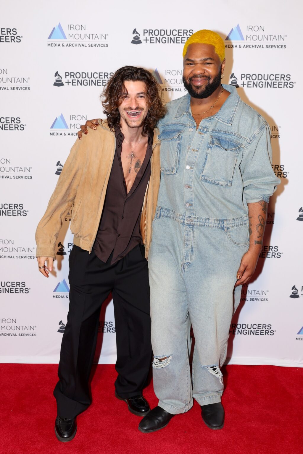 LOS ANGELES, CALIFORNIA - JANUARY 28: (L-R) Mike Sabath and MNEK attend the Producers & Engineers Wing GRAMMY Week Celebration at The Preserve LA on January 28, 2026 in Los Angeles, California. (Photo by Maury Phillips/Getty Images for The Recording Academy)