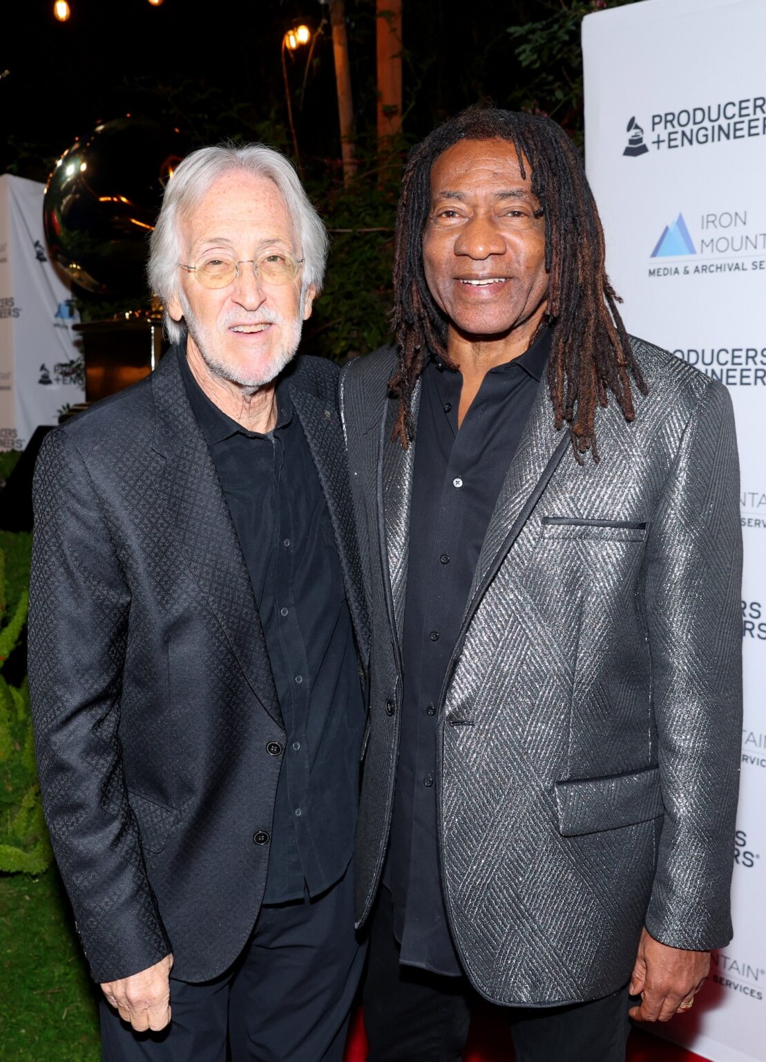 LOS ANGELES, CALIFORNIA - JANUARY 28: (L-R) Neil Portnow and Jimmy Douglass attend the Producers & Engineers Wing GRAMMY Week Celebration at The Preserve LA on January 28, 2026 in Los Angeles, California. (Photo by Maury Phillips/Getty Images for The Recording Academy)