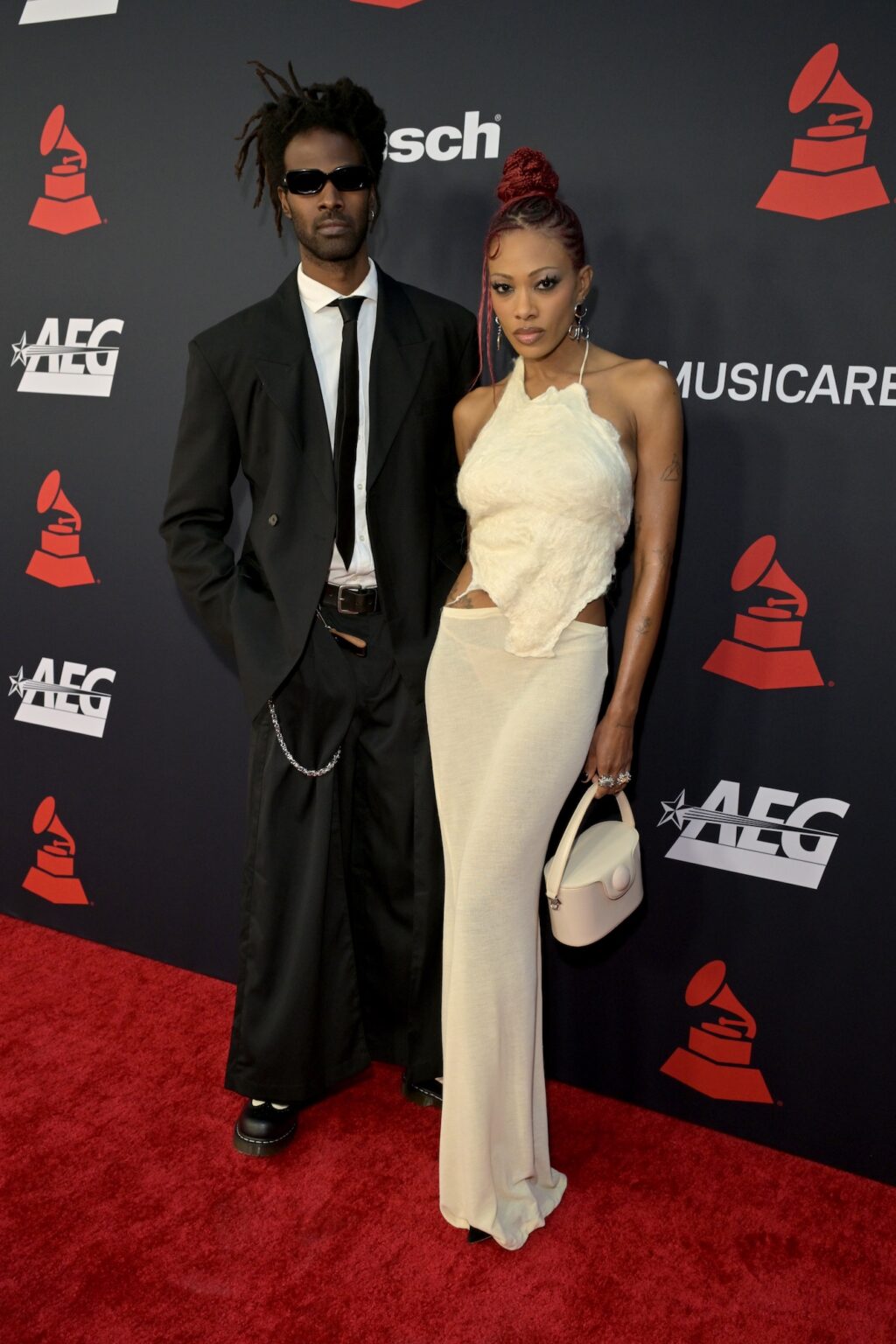 LOS ANGELES, CALIFORNIA - JANUARY 30: (L-R) Raleigh the Vamp and MAAD attend 2026 MusiCares Person of the Year Honoring Mariah Carey on January 30, 2026 in Los Angeles, California. (Photo by Lester Cohen/Getty Images for The Recording Academy)