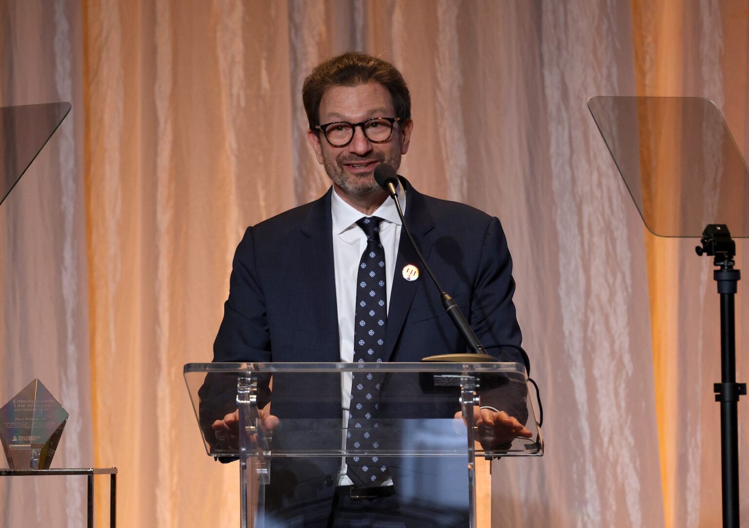 LOS ANGELES, CALIFORNIA - JANUARY 30: Paul Robinsonspeaks during the 68th GRAMMY Awards - 28th Annual Entertainment Law Initiative Luncheon on January 30, 2026 in Los Angeles, California. (Photo by Jesse Grant/Getty Images for The Recording Academy)