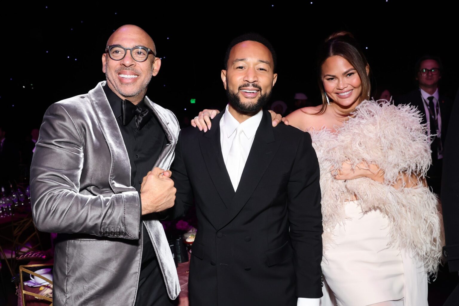 LOS ANGELES, CALIFORNIA - JANUARY 30: (L-R) Harvey Mason jr., CEO, MusiCares & Recording Academy, John Legend, and Chrissy Teigen attend 2026 MusiCares Person of the Year Honoring Mariah Carey on January 30, 2026 in Los Angeles, California. (Photo by Emma McIntyre/Getty Images for The Recording Academy)