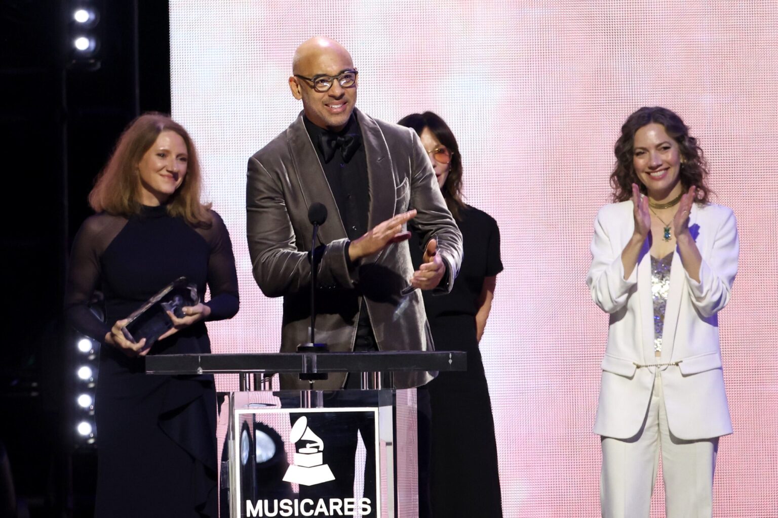 LOS ANGELES, CALIFORNIA - JANUARY 30: (L-R) Theresa Wolters, Executive Director, MusiCares, Harvey Mason jr., CEO, the Recording Academy, Jody Gerson, and Carianne Marshall speak onstage during 2026 MusiCares Person of the Year Honoring Mariah Carey on January 30, 2026 in Los Angeles, California. (Photo by Matt Winkelmeyer/Getty Images for The Recording Academy)