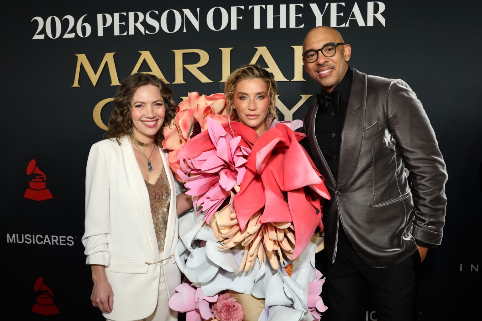 LOS ANGELES, CALIFORNIA - JANUARY 30: (L-R) Carianne Marshall, Co-Chair and COO, Warner Chappell Music, Kesha and Harvey Mason jr., CEO, the Recording Academy attend 2026 MusiCares Person of the Year Honoring Mariah Carey on January 30, 2026 in Los Angeles, California. (Photo by Emma McIntyre/Getty Images for The Recording Academy)