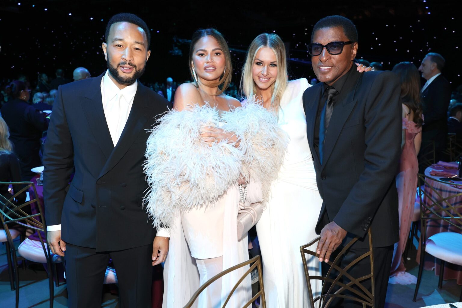 LOS ANGELES, CALIFORNIA - JANUARY 30: (L-R) John Legend, Chrissy Teigen, Rika Tischendorf, and Babyface attend 2026 MusiCares Person of the Year Honoring Mariah Carey on January 30, 2026 in Los Angeles, California. (Photo by Kevin Mazur/Getty Images for The Recording Academy)