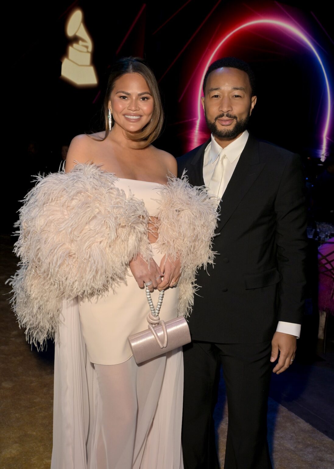 LOS ANGELES, CALIFORNIA - JANUARY 30: (L-R) Chrissy Teigen and John Legend attend 2026 MusiCares Person of the Year Honoring Mariah Carey on January 30, 2026 in Los Angeles, California. (Photo by Lester Cohen/Getty Images for The Recording Academy)