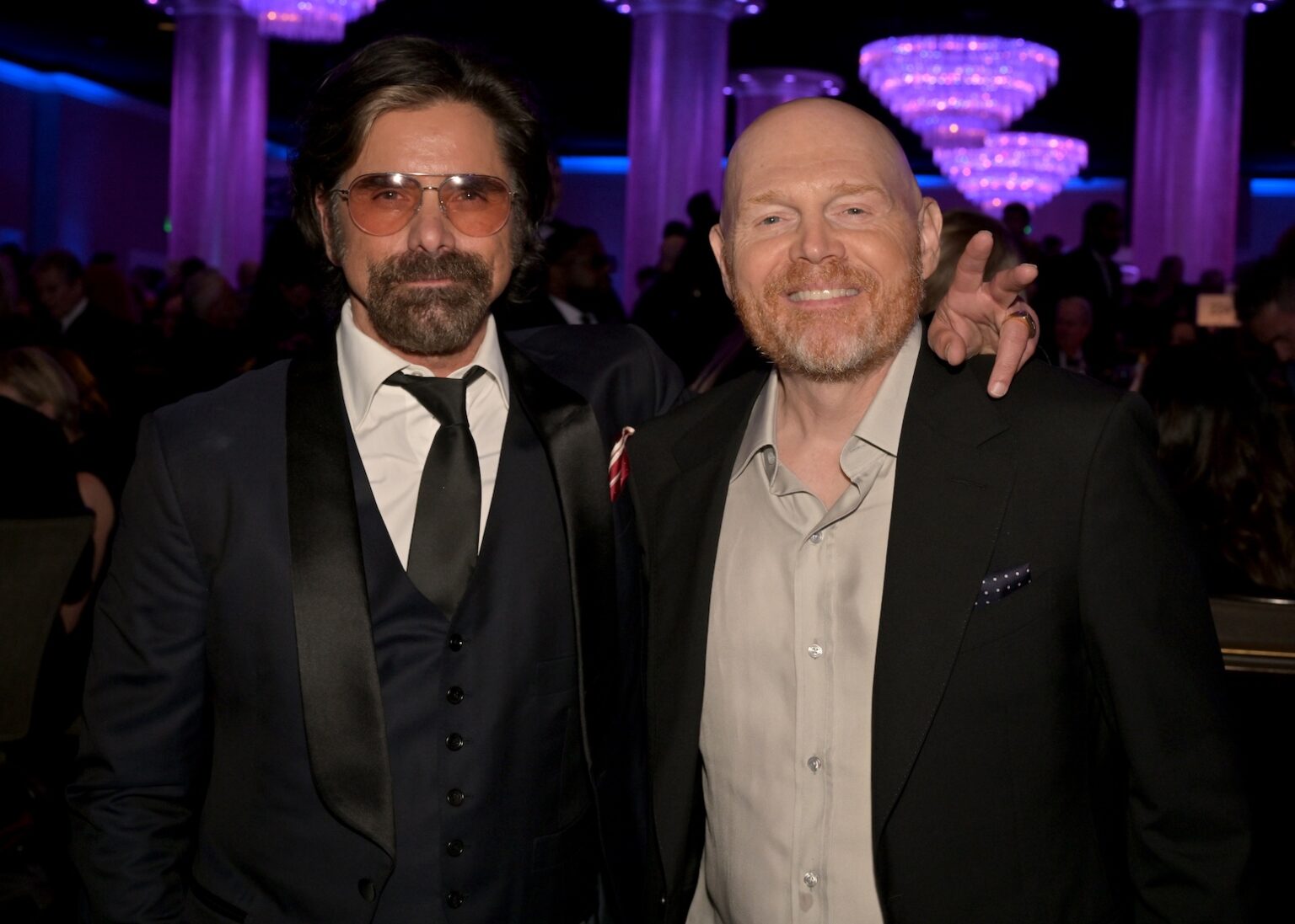 LOS ANGELES, CALIFORNIA - JANUARY 31: (L-R) John Stamos and Bill Burr attend the 68th GRAMMY Awards Pre-GRAMMY Gala & GRAMMY Salute to Industry Icons Honoring Avery Lipman & Monte Lipman on January 31, 2026 in Los Angeles, California. (Photo by Lester Cohen/Getty Images for The Recording Academy)