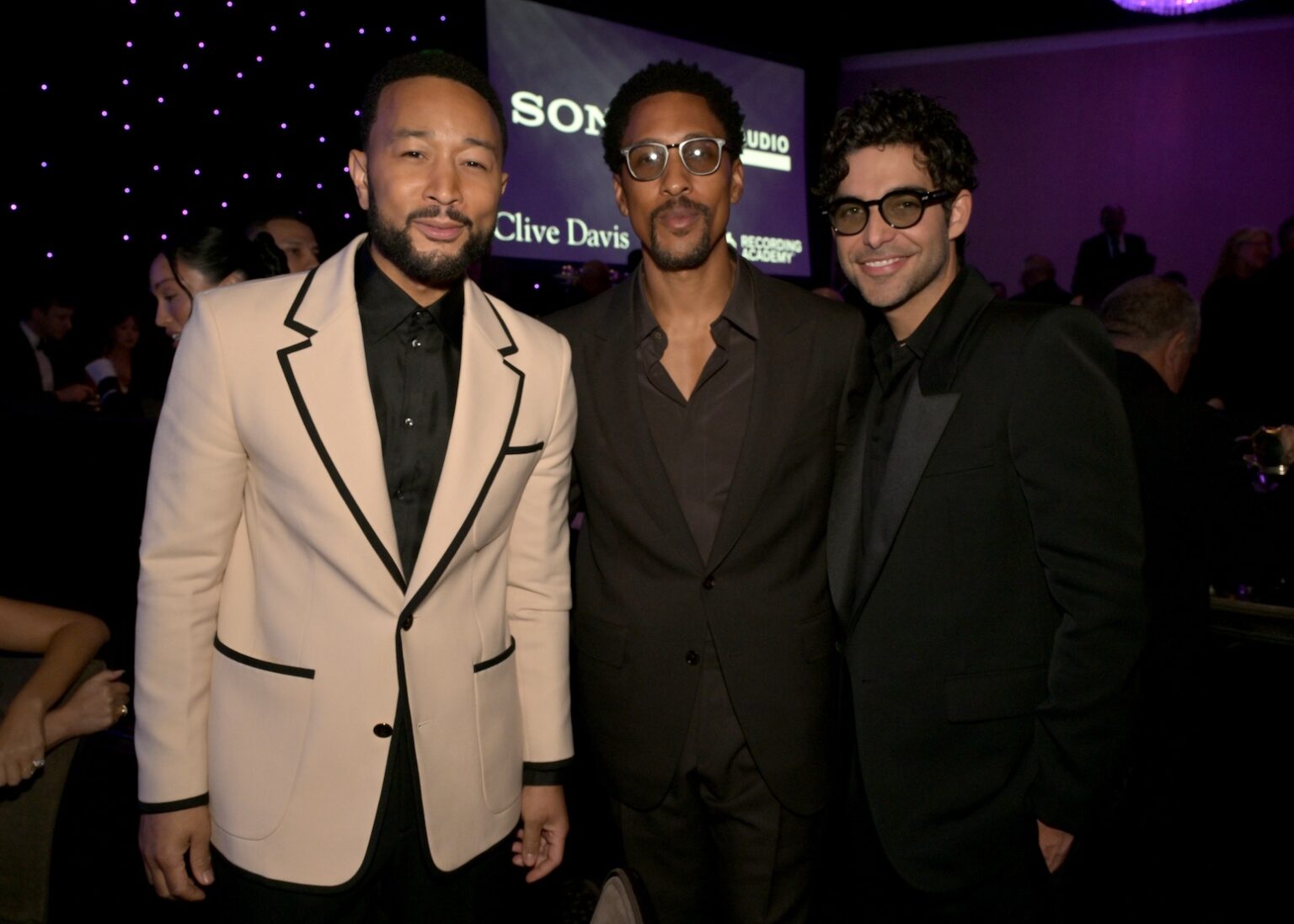 LOS ANGELES, CALIFORNIA - JANUARY 31: (L-R) John Legend, Larry Jackson and Freddy Wexler attend the 68th GRAMMY Awards Pre-GRAMMY Gala & GRAMMY Salute to Industry Icons Honoring Avery Lipman & Monte Lipman on January 31, 2026 in Los Angeles, California. (Photo by Lester Cohen/Getty Images for The Recording Academy)