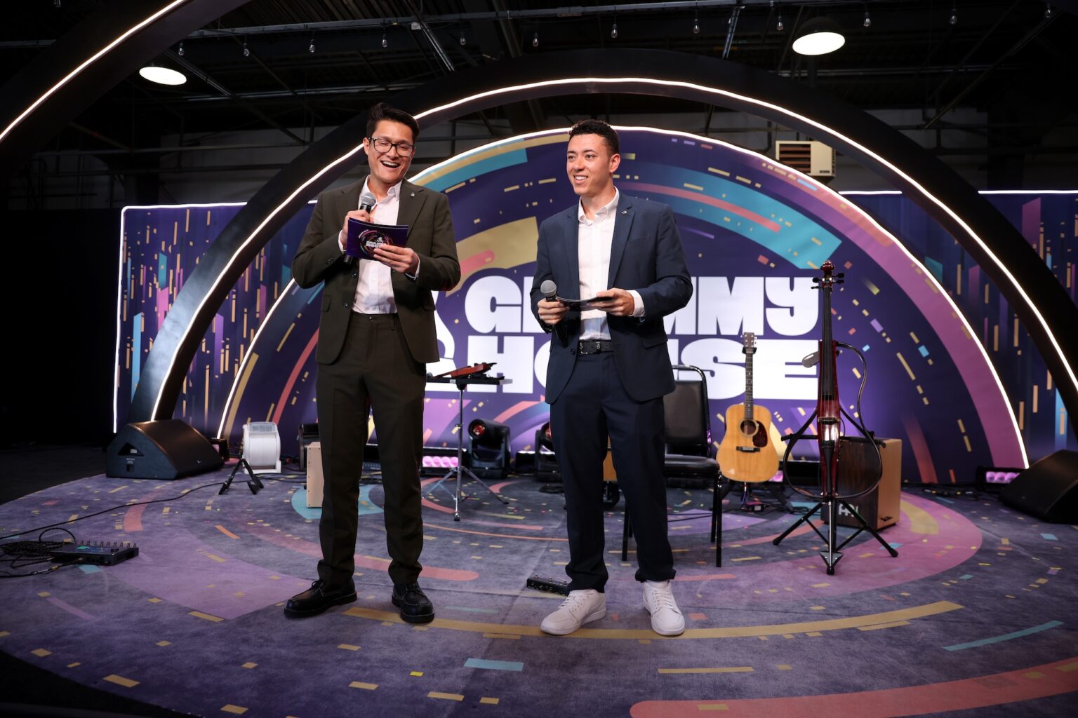 LOS ANGELES, CALIFORNIA - JANUARY 31: (L-R) Kenneth Tran and Ricky Lyon speak onstage during Golden Hour at GRAMMY House during the 68th GRAMMY Awards at Rolling Greens on January 31, 2026 in Los Angeles, California. (Photo by Anna Webber/Getty Images for The Recording Academy)
