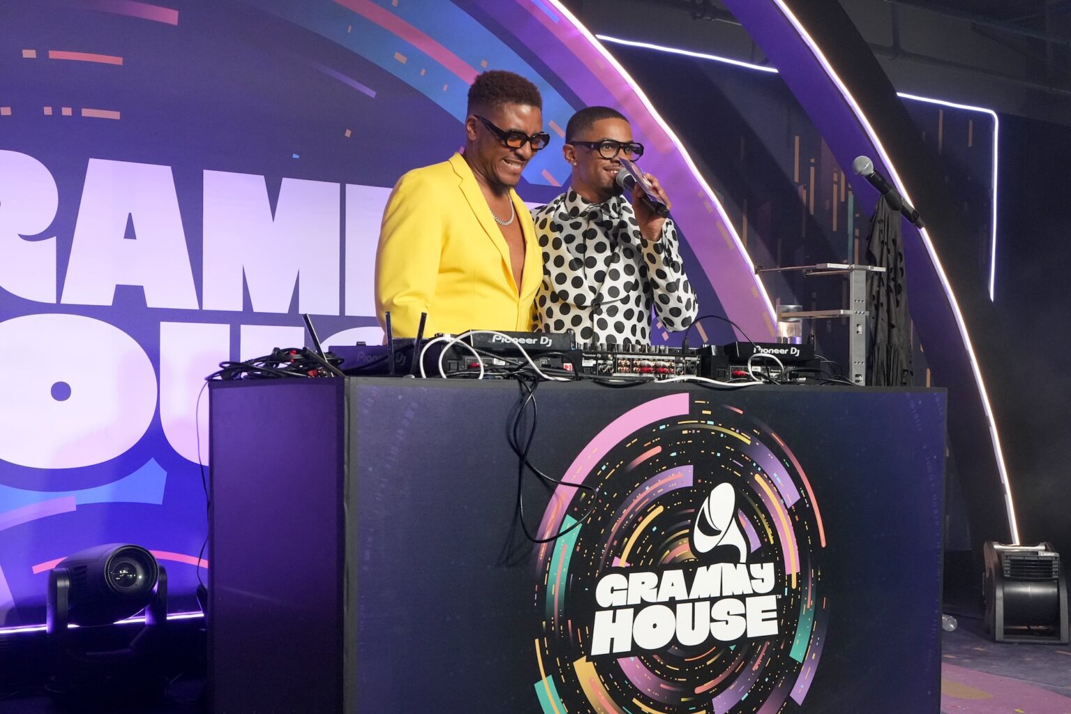 LOS ANGELES, CALIFORNIA - JANUARY 31: (R) Jus10 speaks onstage during the 68th GRAMMY Awards - GRAMMY House: Academy Proud on January 31, 2026 in Los Angeles, California. (Photo by Unique Nicole/Getty Images for The Recording Academy)