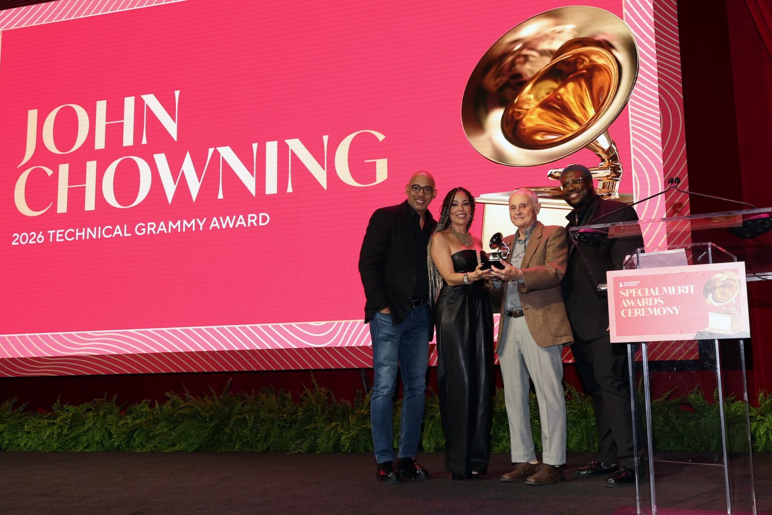 LOS ANGELES, CALIFORNIA - JANUARY 31: (L-R) Harvey Mason jr., CEO, the Recording Academy, Marcella Araica, John Chowning and Swagg R’Celious pose onstage during the Special Merit Awards Ceremony & 68th Annual GRAMMY Nominees Reception during the 68th GRAMMY Awards on January 31, 2026 in Los Angeles, California. (Photo by Mat Hayward/Getty Images for The Recording Academy)