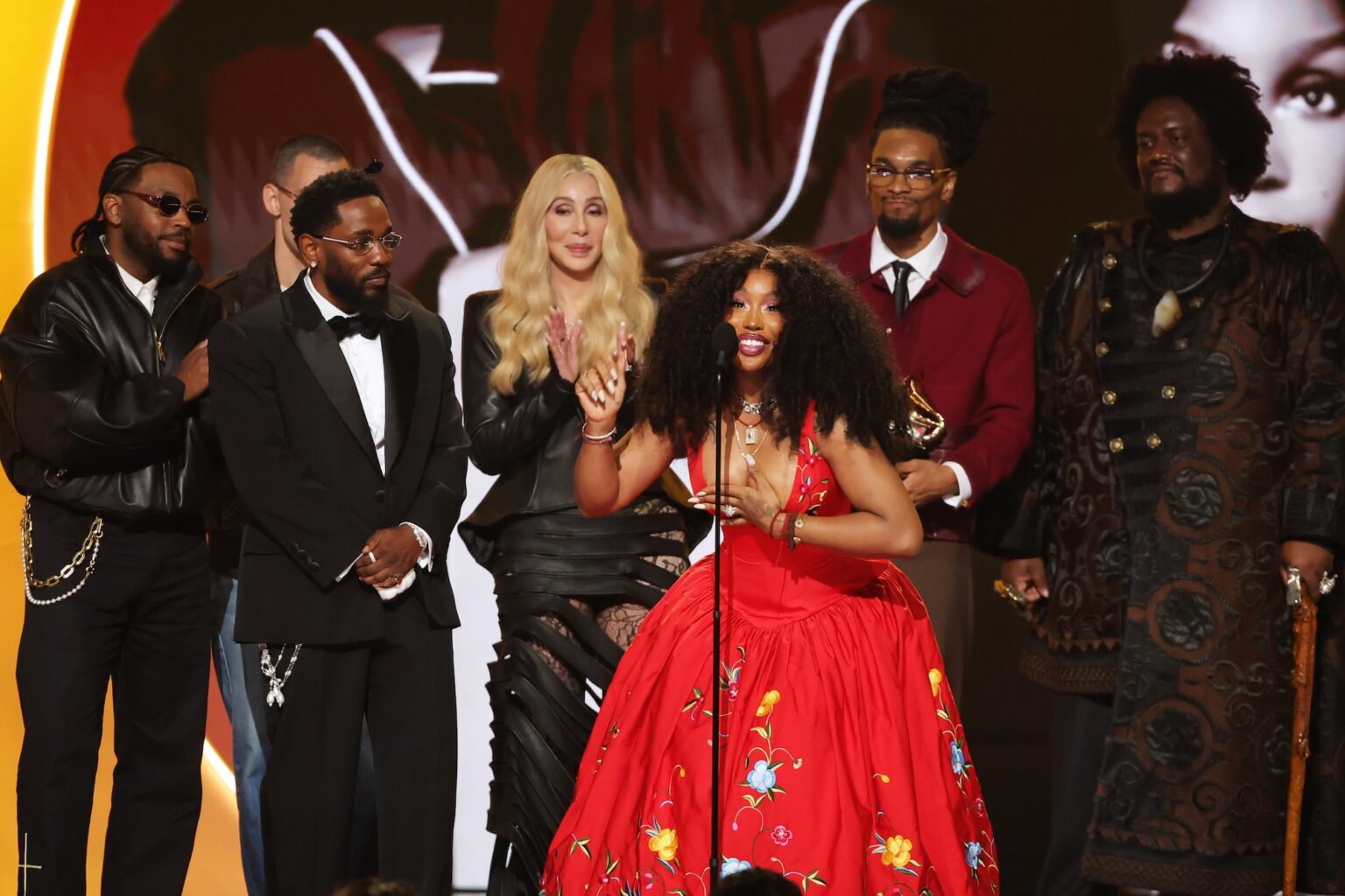 LOS ANGELES, CALIFORNIA - FEBRUARY 01: Cher (3rd L) presents the Record Of The Year award for "luther" to (from L) Sounwave, Jack Antonoff, Kendrick Lamar, SZA, Scott Bridgeway, and Kamasi Washington onstage during the 68th GRAMMY Awards at Crypto.com Arena on February 01, 2026 in Los Angeles, California. (Photo by Kevin Winter/Getty Images for The Recording Academy)