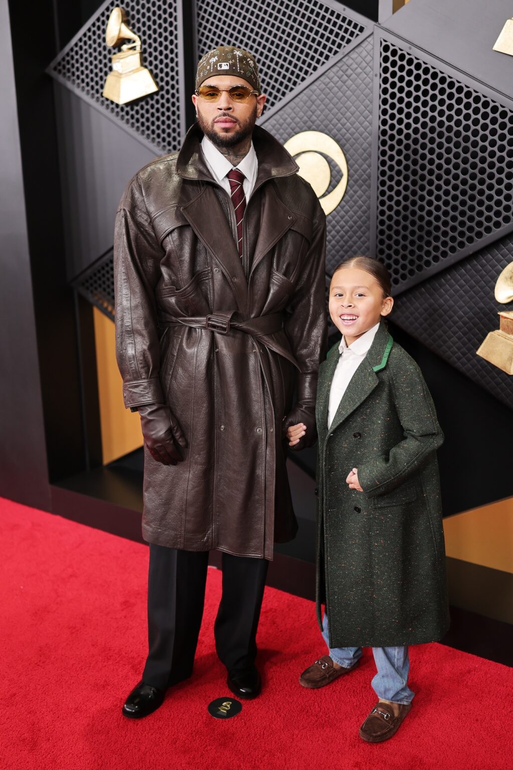 LOS ANGELES, CALIFORNIA - FEBRUARY 01: Chris Brown (L) and a guest attend the 68th GRAMMY Awards on February 01, 2026 in Los Angeles, California. (Photo by Neilson Barnard/Getty Images for The Recording Academy)