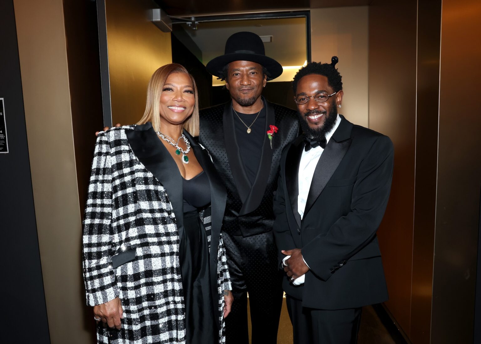 LOS ANGELES, CALIFORNIA - FEBRUARY 01: (L-R) Queen Latifah, Q-Tip and Kendrick Lamar attend the 68th GRAMMY Awards at Crypto.com Arena on February 01, 2026 in Los Angeles, California. (Photo by Monica Schipper/Getty Images for The Recording Academy)