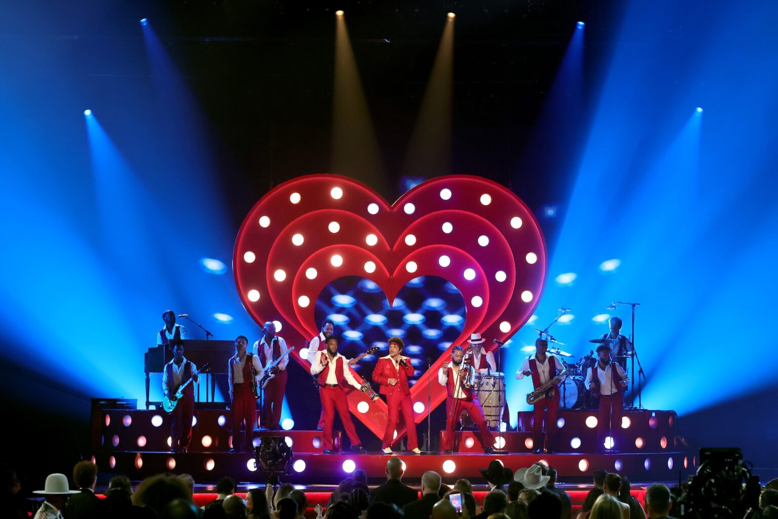 LOS ANGELES, CALIFORNIA - FEBRUARY 01: Bruno Mars (C) performs onstage during the 68th GRAMMY Awards at Crypto.com Arena on February 01, 2026 in Los Angeles, California. (Photo by Kevin Winter/Getty Images for The Recording Academy)