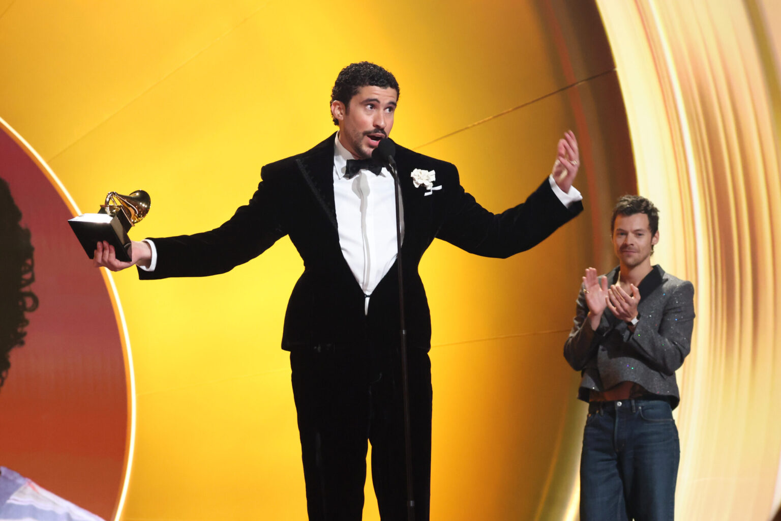 LOS ANGELES, CALIFORNIA - FEBRUARY 01: Bad Bunny accepts the Album of the Year award for "DeBÍ TiRAR MáS FOToS" from Harry Styles onstage during the 68th GRAMMY Awards at Crypto.com Arena on February 01, 2026 in Los Angeles, California. (Photo by Kevin Mazur/Getty Images for The Recording Academy)