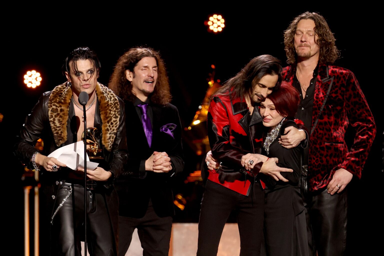LOS ANGELES, CALIFORNIA - FEBRUARY 01: YUNGBLUD accepts the Best Rock Performance award for "Changes (Live From Villa Park) Back To The Beginning" onstage with Frank Bello, Nuno Bettencourt, Sharon Osbourne and Adam Wakeman during the 68th GRAMMY Awards Premiere Ceremony at Peacock Theater on February 01, 2026 in Los Angeles, California. (Photo by Matt Winkelmeyer/Getty Images for The Recording Academy)