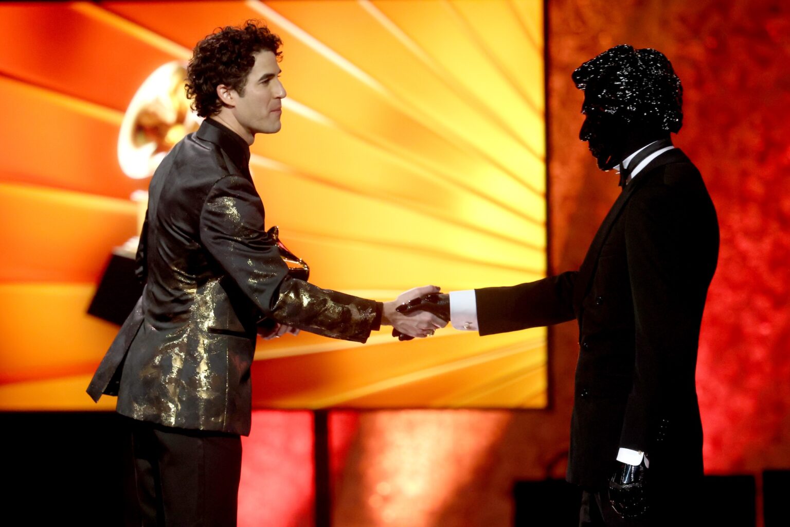 LOS ANGELES, CALIFORNIA - FEBRUARY 01: Gesaffelstein (R) accepts the Best Remixed Recording award for "Abracadabra - Gesaffelstein Remix" from Darren Criss (L) onstage during the 68th GRAMMY Awards Premiere Ceremony at Peacock Theater on February 01, 2026 in Los Angeles, California. (Photo by Matt Winkelmeyer/Getty Images for The Recording Academy)