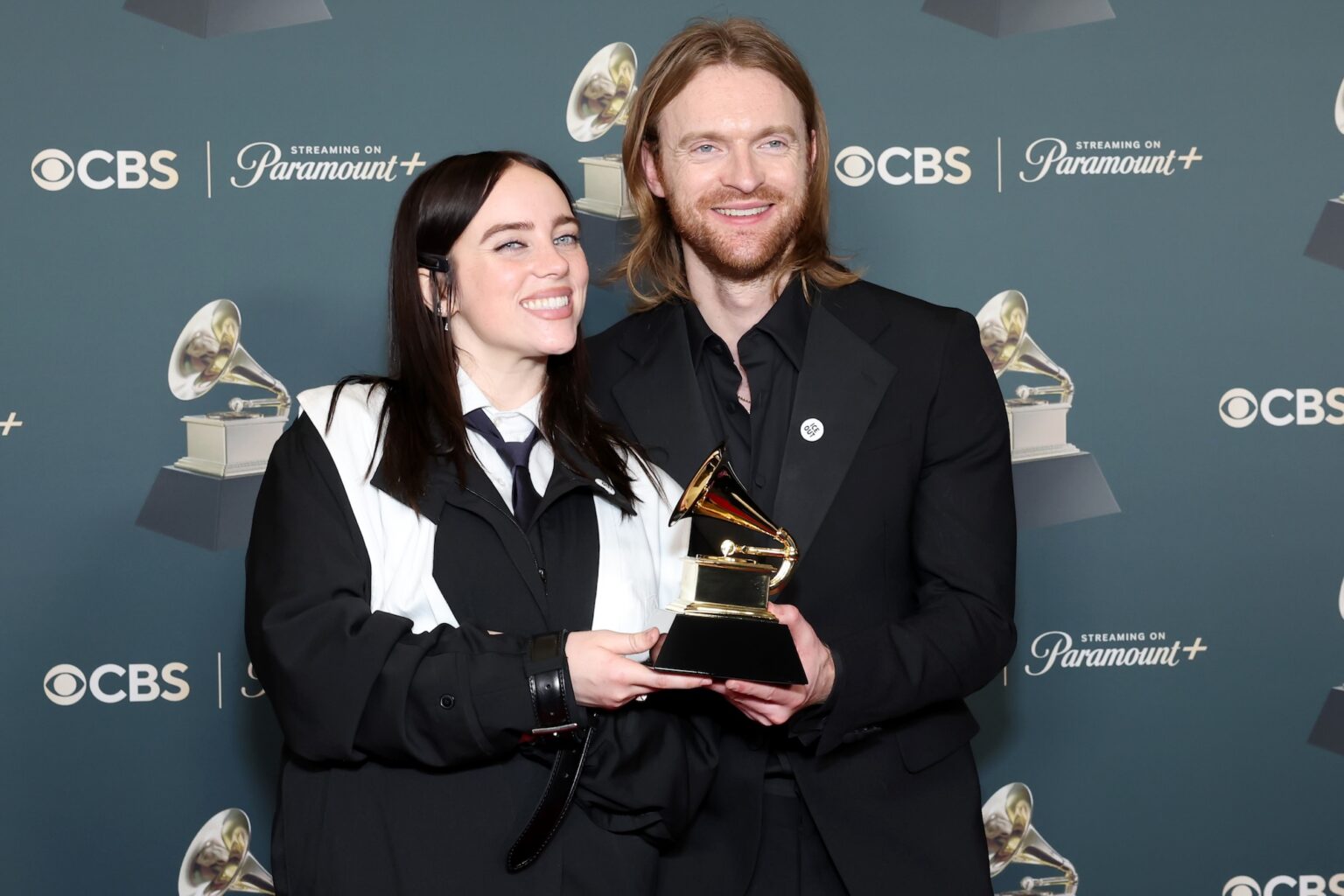 LOS ANGELES, CALIFORNIA - FEBRUARY 01: (L-R) Billie Eilish and Finneas O'Connell, winners of the Song of the Year award for ìWILDFLOWERî, pose in the press room during the 68th GRAMMY Awards at Crypto.com Arena on February 01, 2026 in Los Angeles, California. (Photo by Leon Bennett/Getty Images for The Recording Academy)