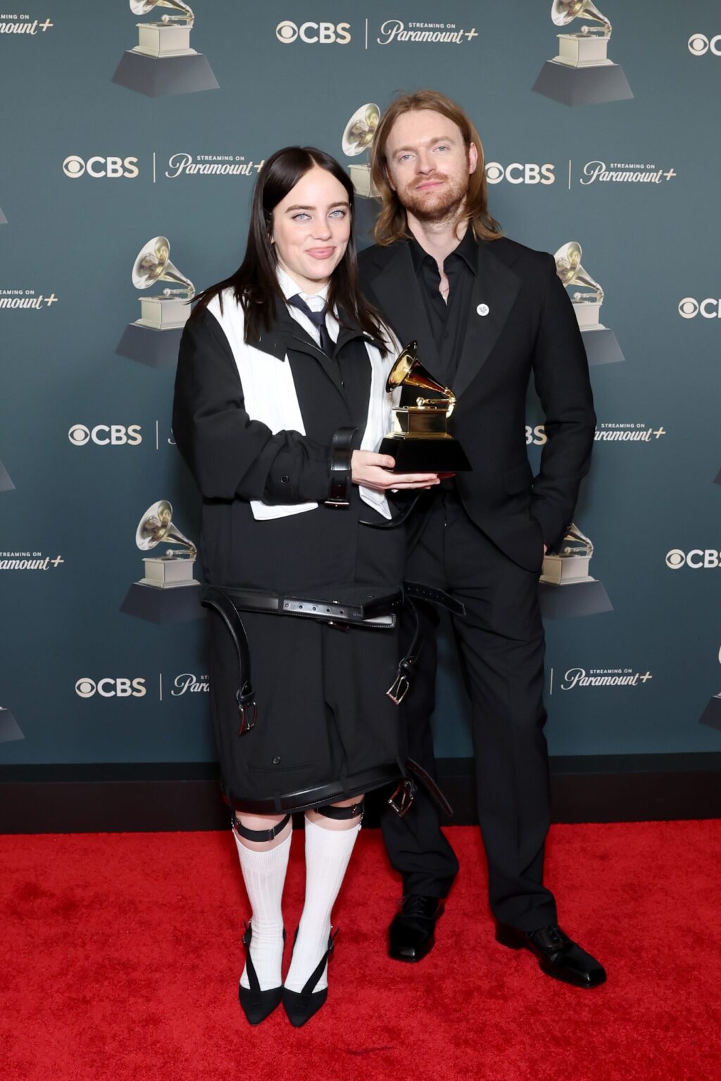 LOS ANGELES, CALIFORNIA - FEBRUARY 01: (L-R) Billie Eilish and Finneas O'Connell, winners of the Song of the Year award for ìWILDFLOWERî, pose in the press room during the 68th GRAMMY Awards at Crypto.com Arena on February 01, 2026 in Los Angeles, California. (Photo by Leon Bennett/Getty Images for The Recording Academy)