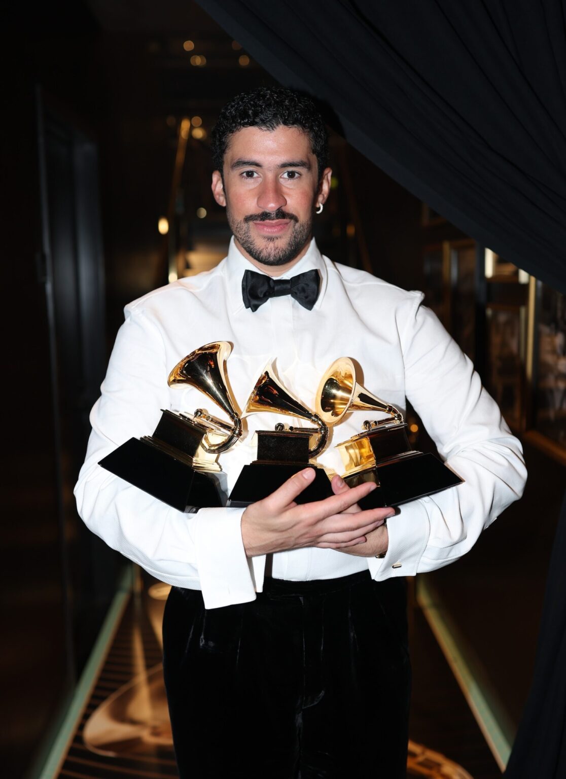 LOS ANGELES, CALIFORNIA - FEBRUARY 01: Bad Bunny poses with the Album of the Year, Best Música Urbana Album, and Best Global Music Performance Awards during the 68th GRAMMY Awards at Crypto.com Arena on February 01, 2026 in Los Angeles, California. (Photo by Matt Winkelmeyer/Getty Images for The Recording Academy)