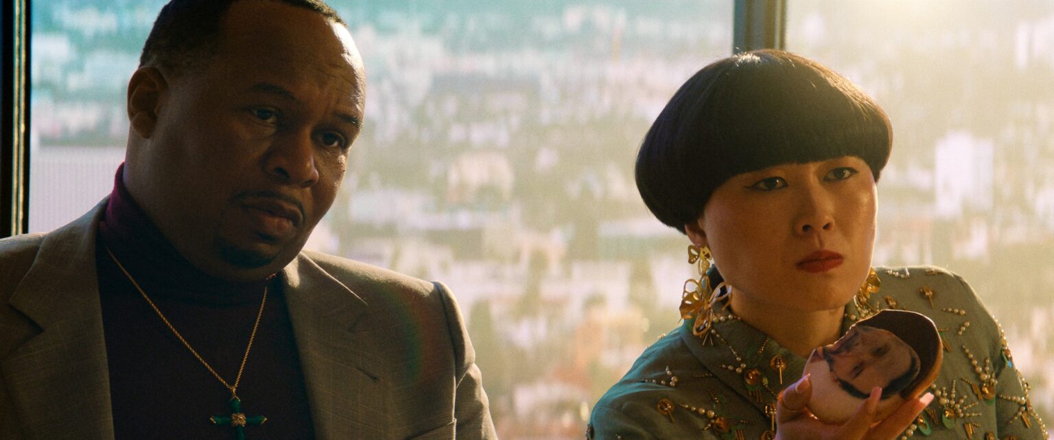 Roy Wood Jr. and Atsuko Okatsuka in "Outcome," premiering April 10, 2026 on Apple TV.