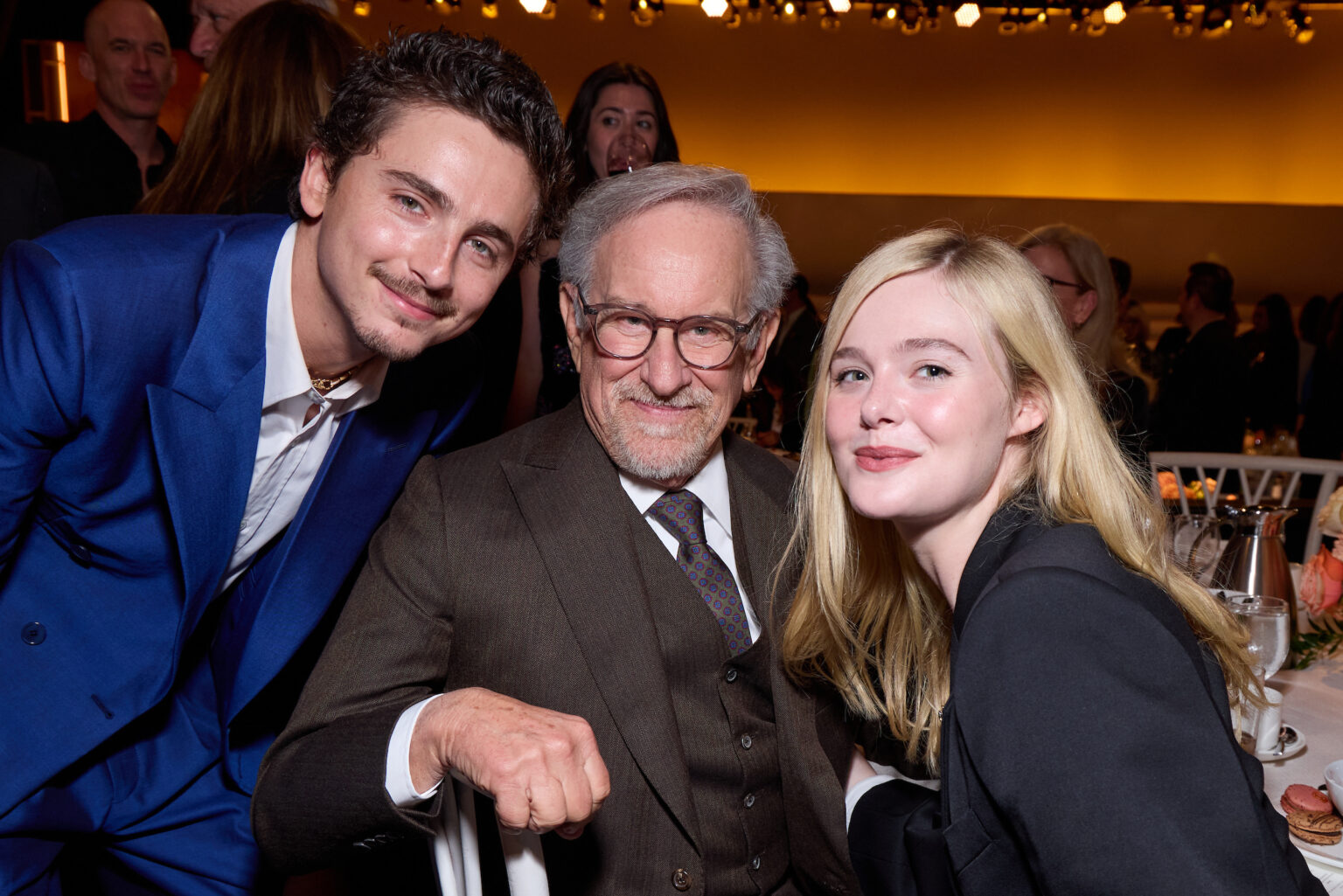 Timothée Chalamet, Steven Spielberg and Elle Fanning at the Oscar Nominee Luncheon held in the International Ballroom at the Beverly Hilton on Tuesday, February 10, 2026.
