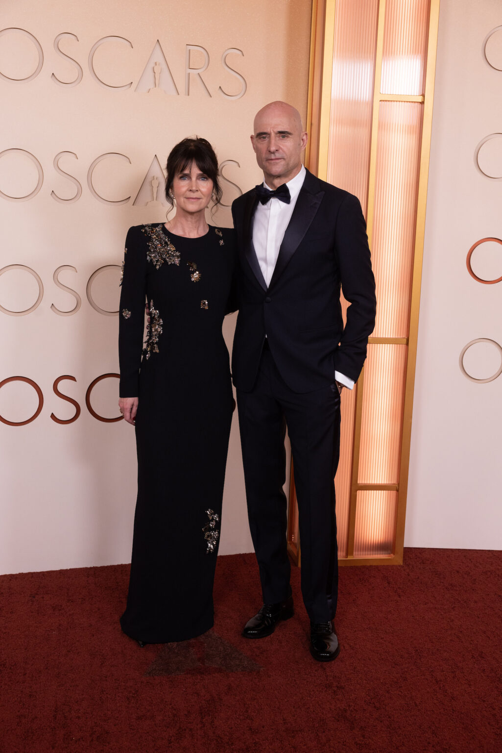 Liza Marshall and Mark Strong arrive on the red carpet of the 98th Oscars® at the Dolby® Theatre at Ovation Hollywood on Sunday, March 15, 2026.