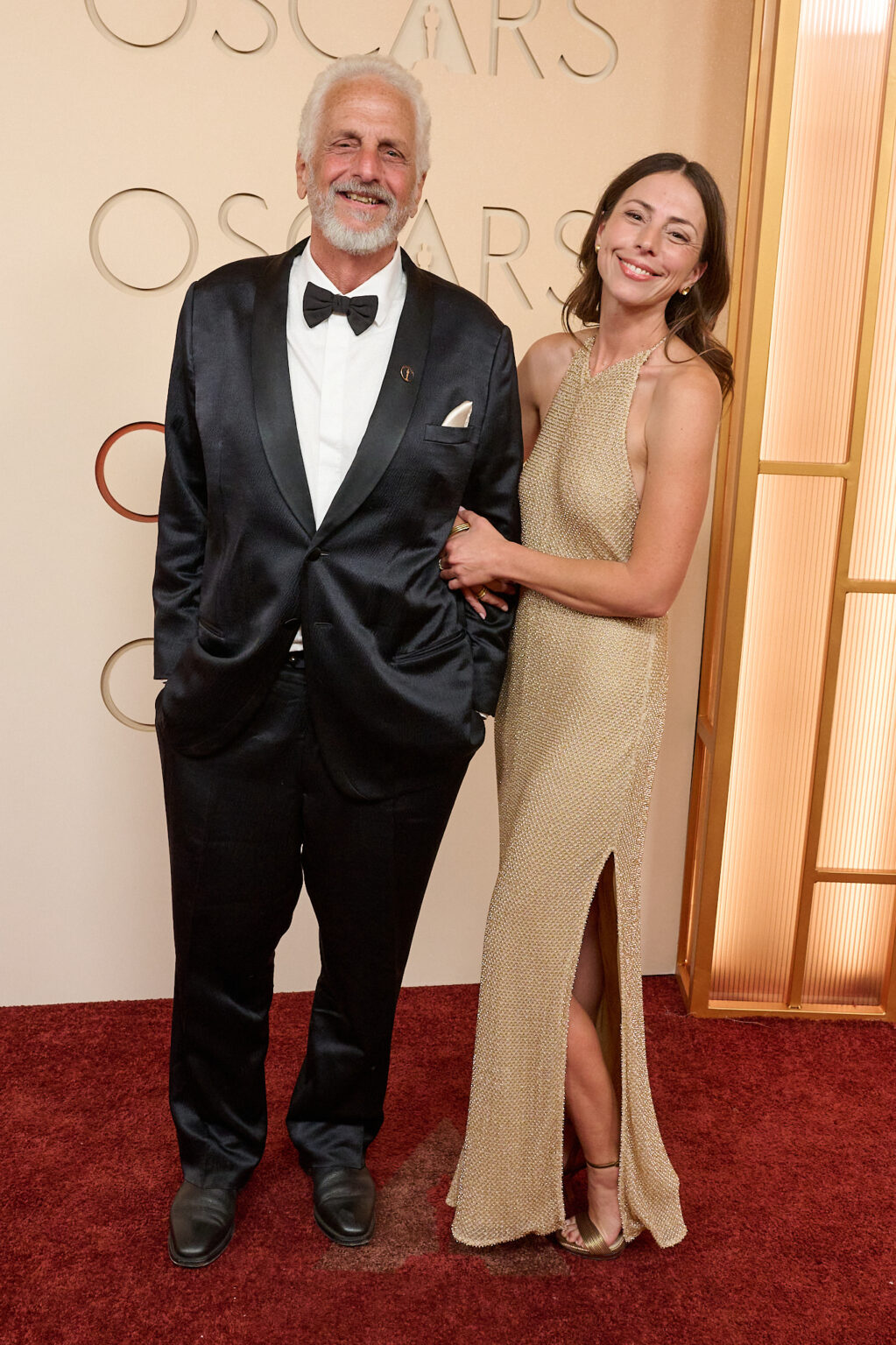 Richard Gibbs and guest arrive on the red carpet of the 98th Oscars® at the Dolby® Theatre at Ovation Hollywood on Sunday, March 15, 2026.