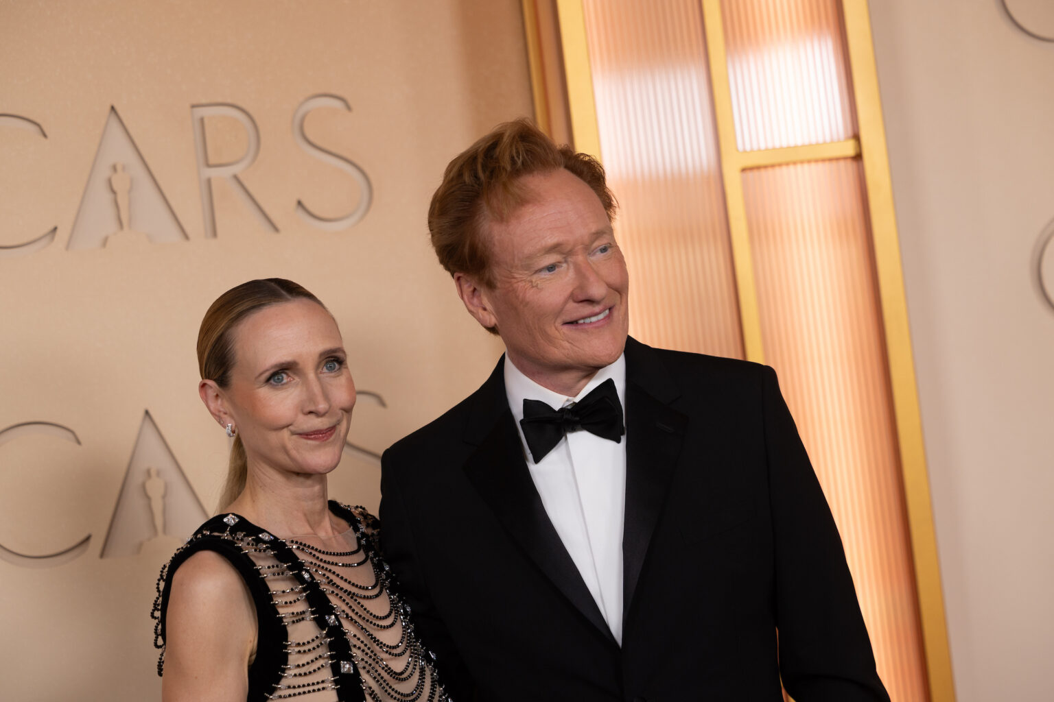 (L-R) Liza Powel O'Brien and Conan O'Brien arrive on the red carpet of the 98th Oscars® at the Dolby® Theatre at Ovation Hollywood on Sunday, March 15, 2026.
