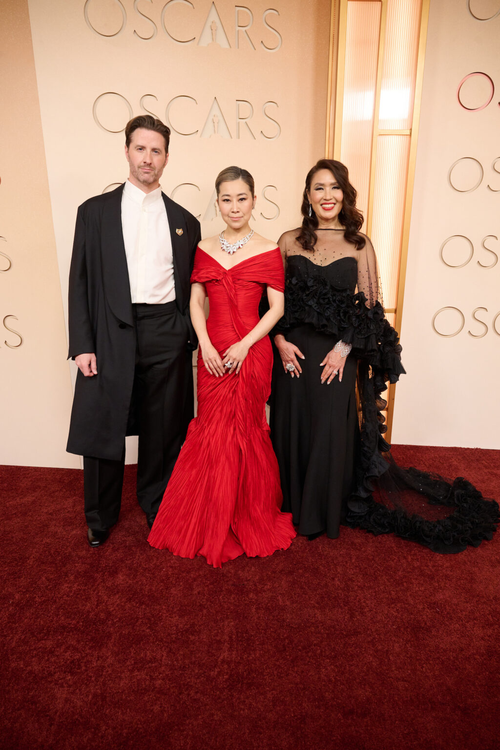 Chris Appelhans, Maggie Kang, and Michelle L. M. Wong arrive on the red carpet of the 98th Oscars® at the Dolby® Theatre at Ovation Hollywood on Sunday, March 15, 2026.