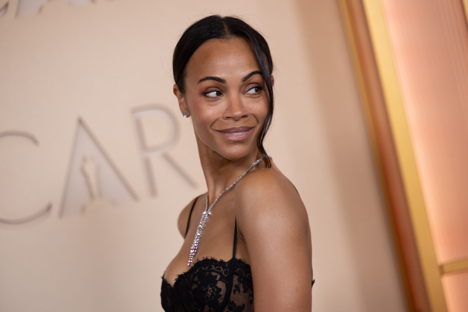 Zoe Saldaña arrives on the red carpet of the 98th Oscars® at the Dolby® Theatre at Ovation Hollywood on Sunday, March 15, 2026.